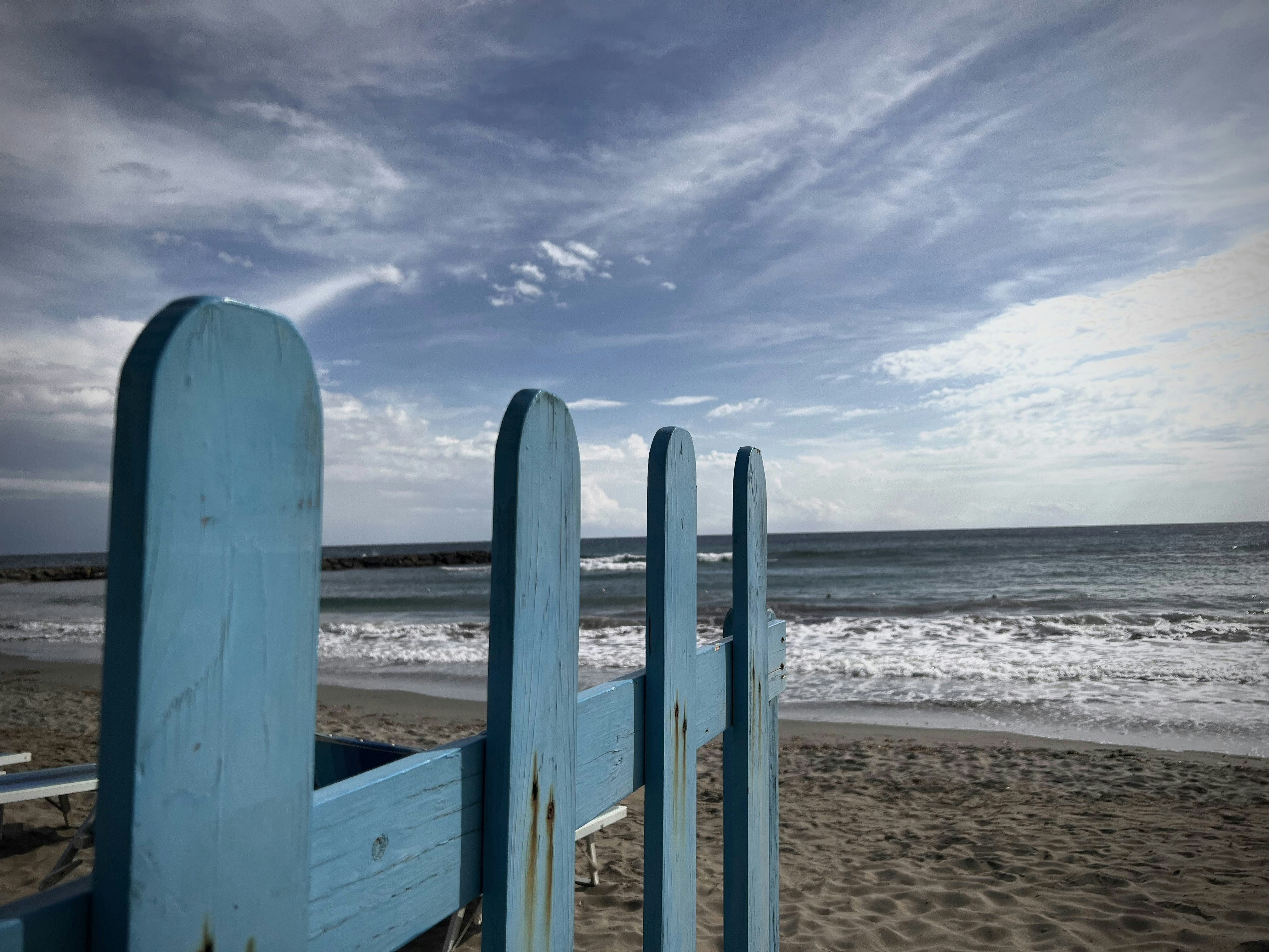 Blue picket fence on sandy beach - Free Photo on Unsplash