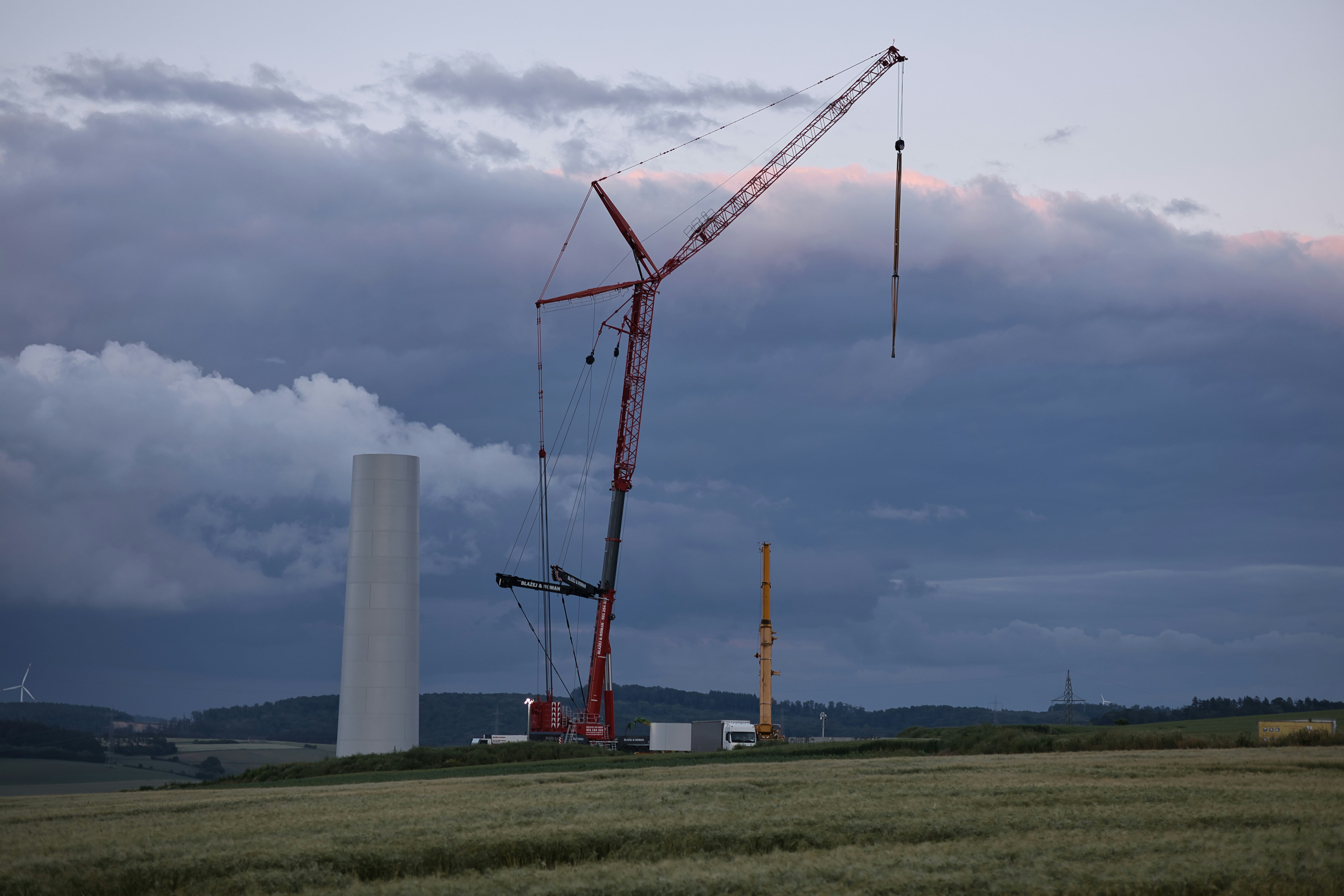 Red crane at wind turbine site - Free Photo on Unsplash