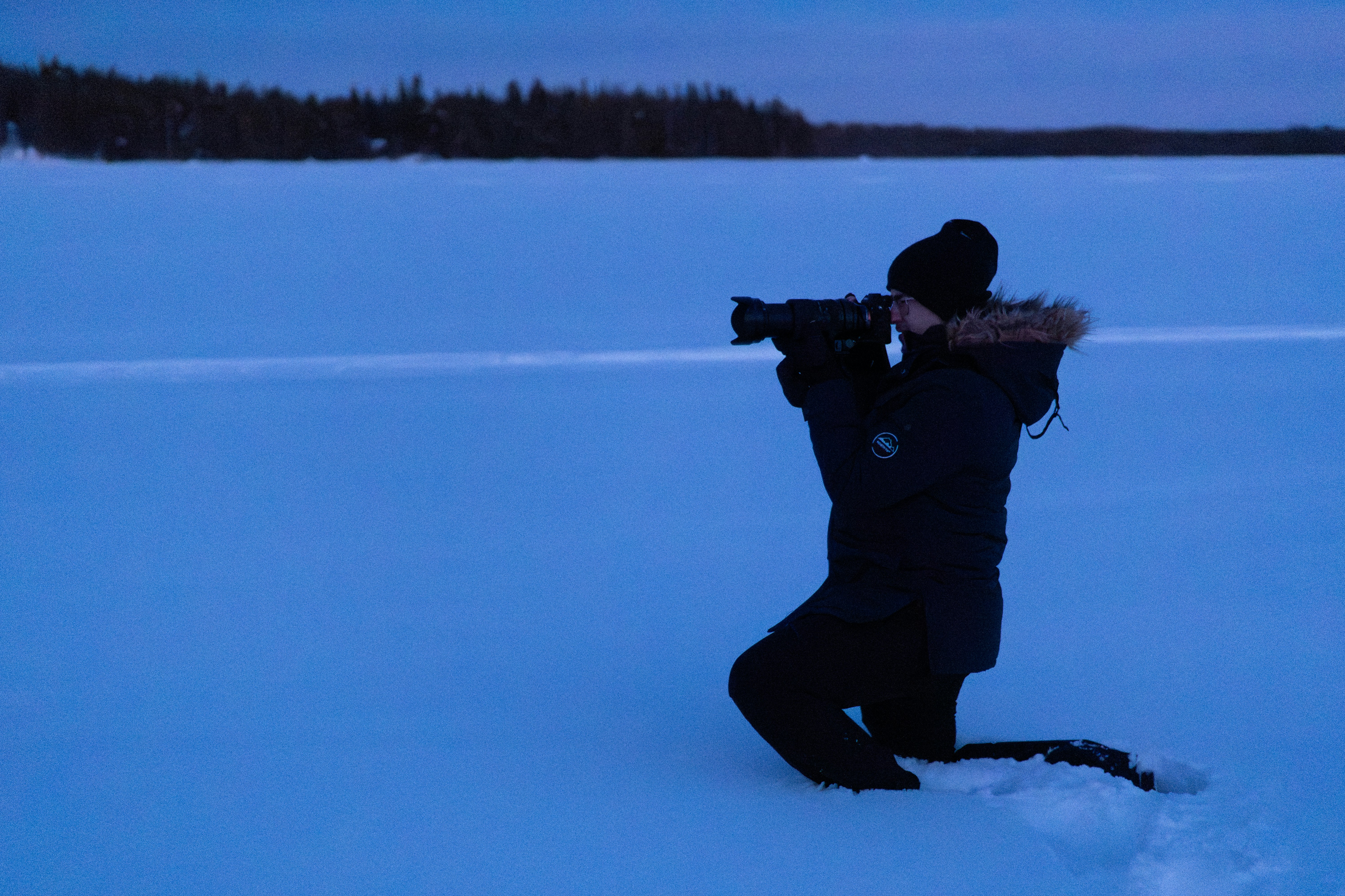 Person taking photograph on frozen lake - Free Photo on Unsplash
