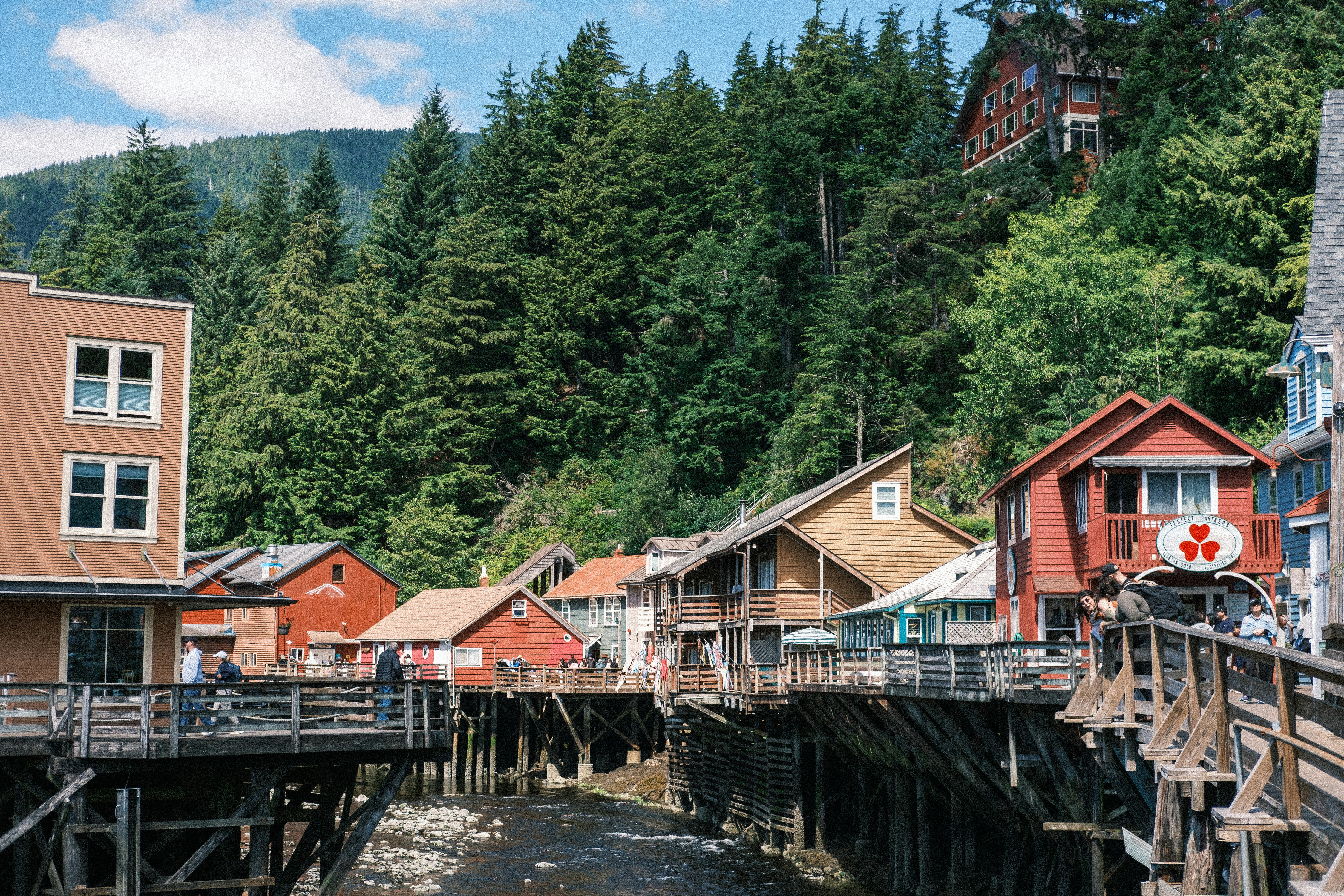 Wooden buildings on stilts along creek - Free Photo on Unsplash