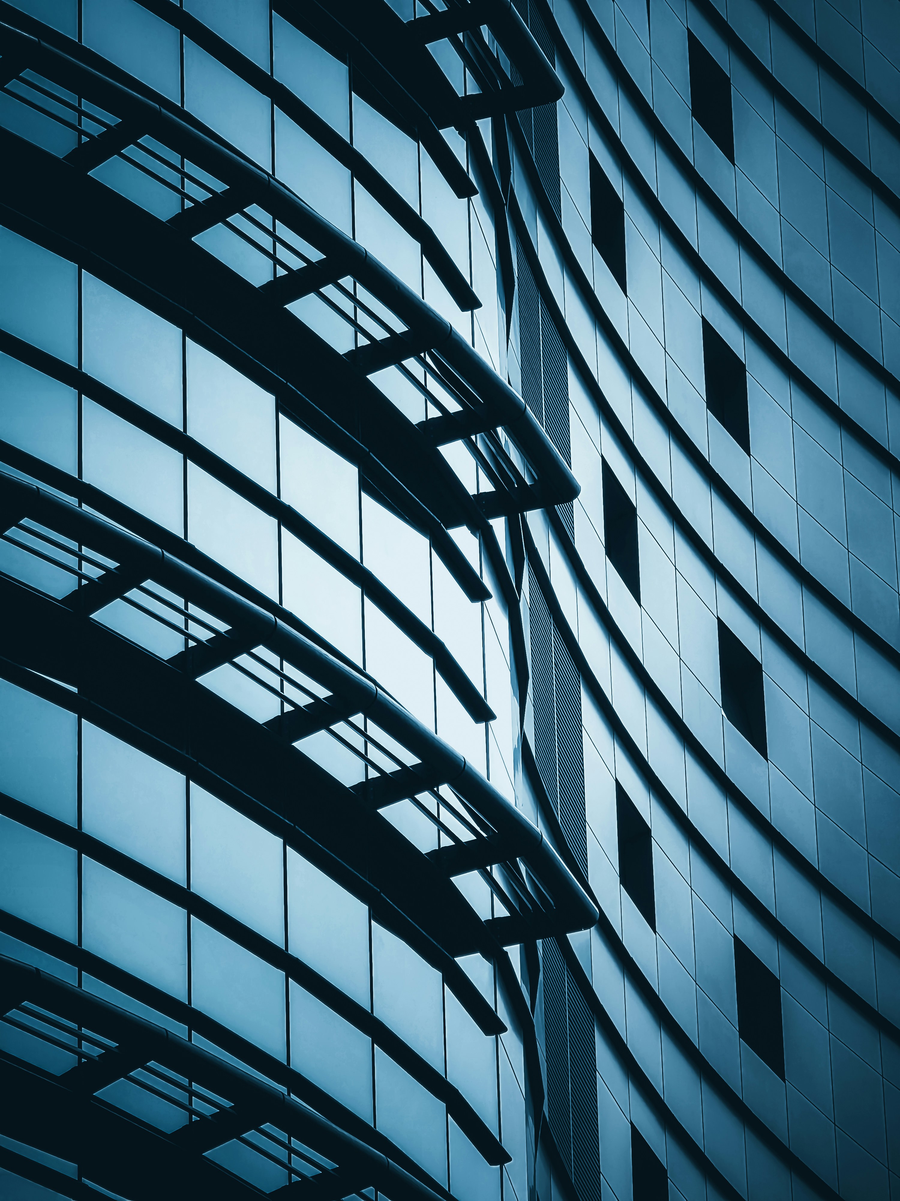 Modern glass skyscraper with blue balconies - Free Photo on Unsplash