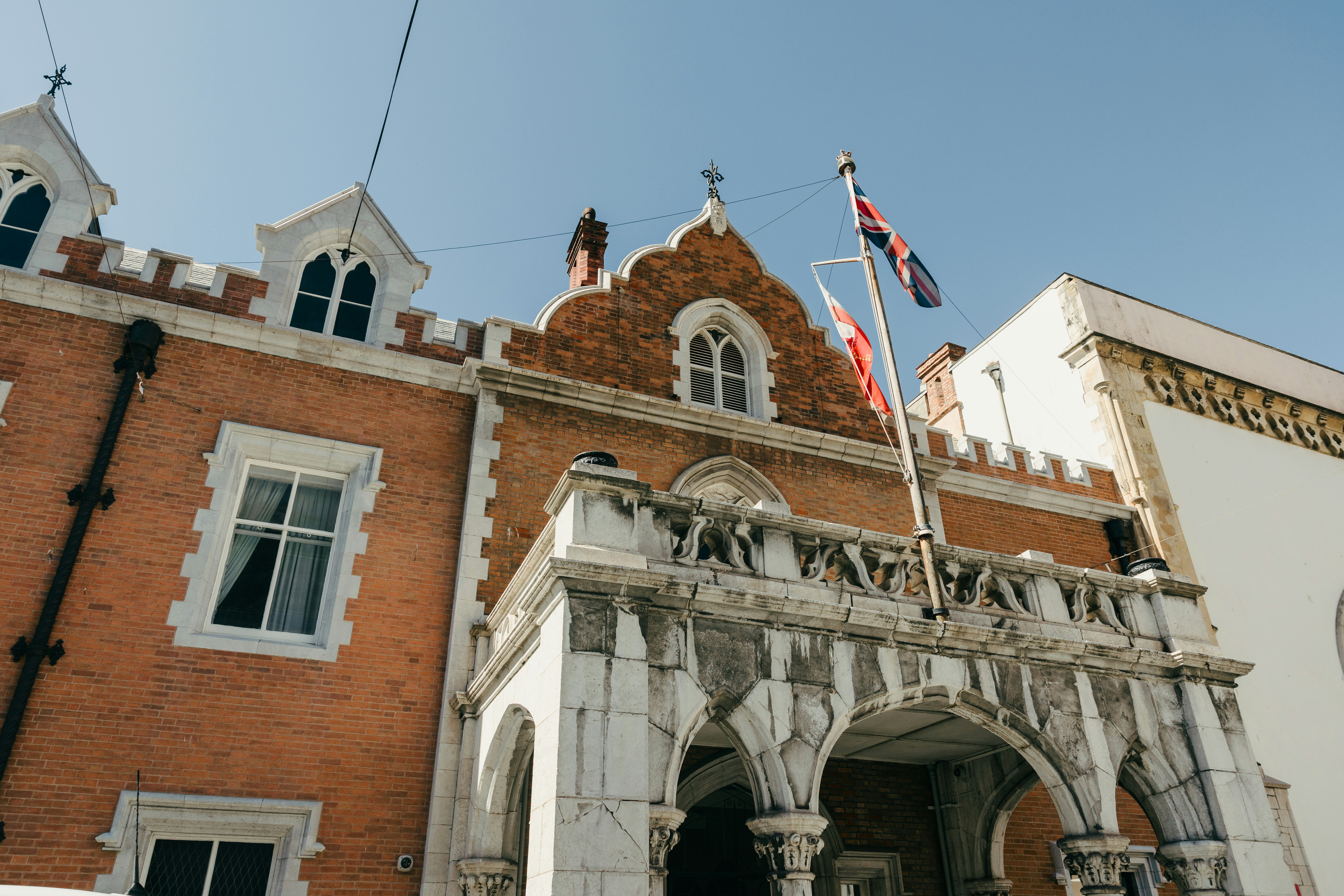 Historic brick building with stone balcony - Free Photo on Unsplash