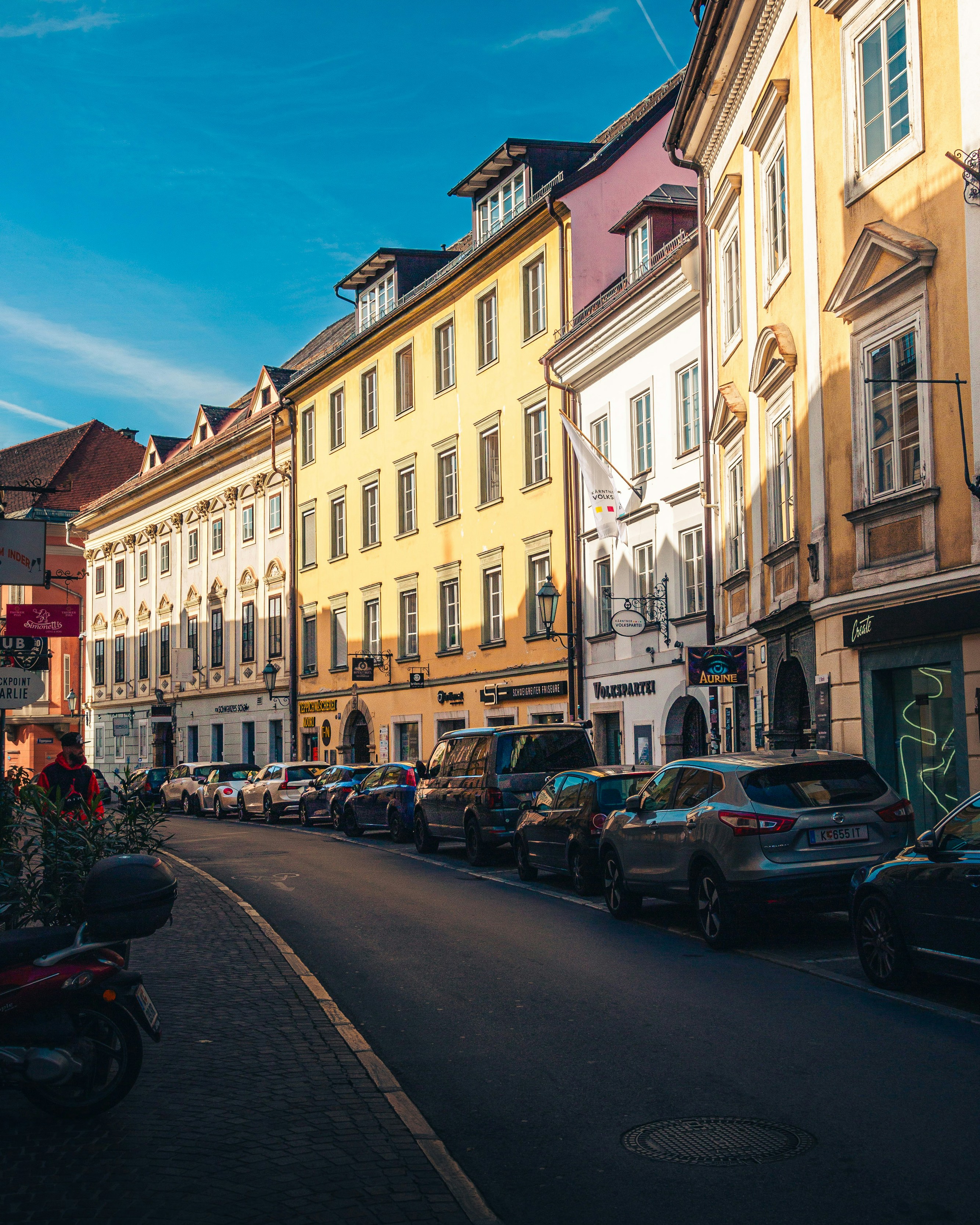 Cars parked on historic city street - Free Photo on Unsplash