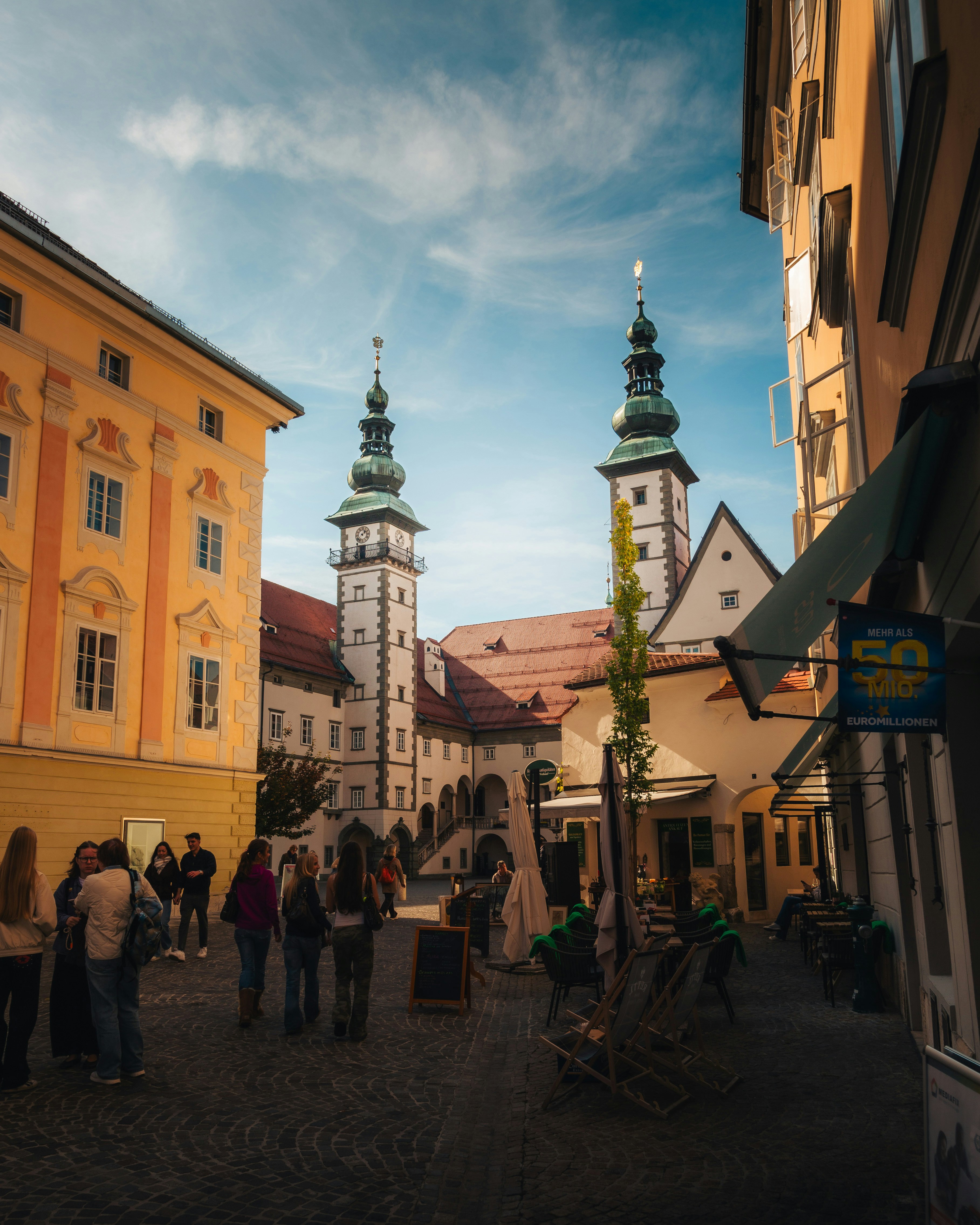 Historic square with towers and people - Free Photo on Unsplash