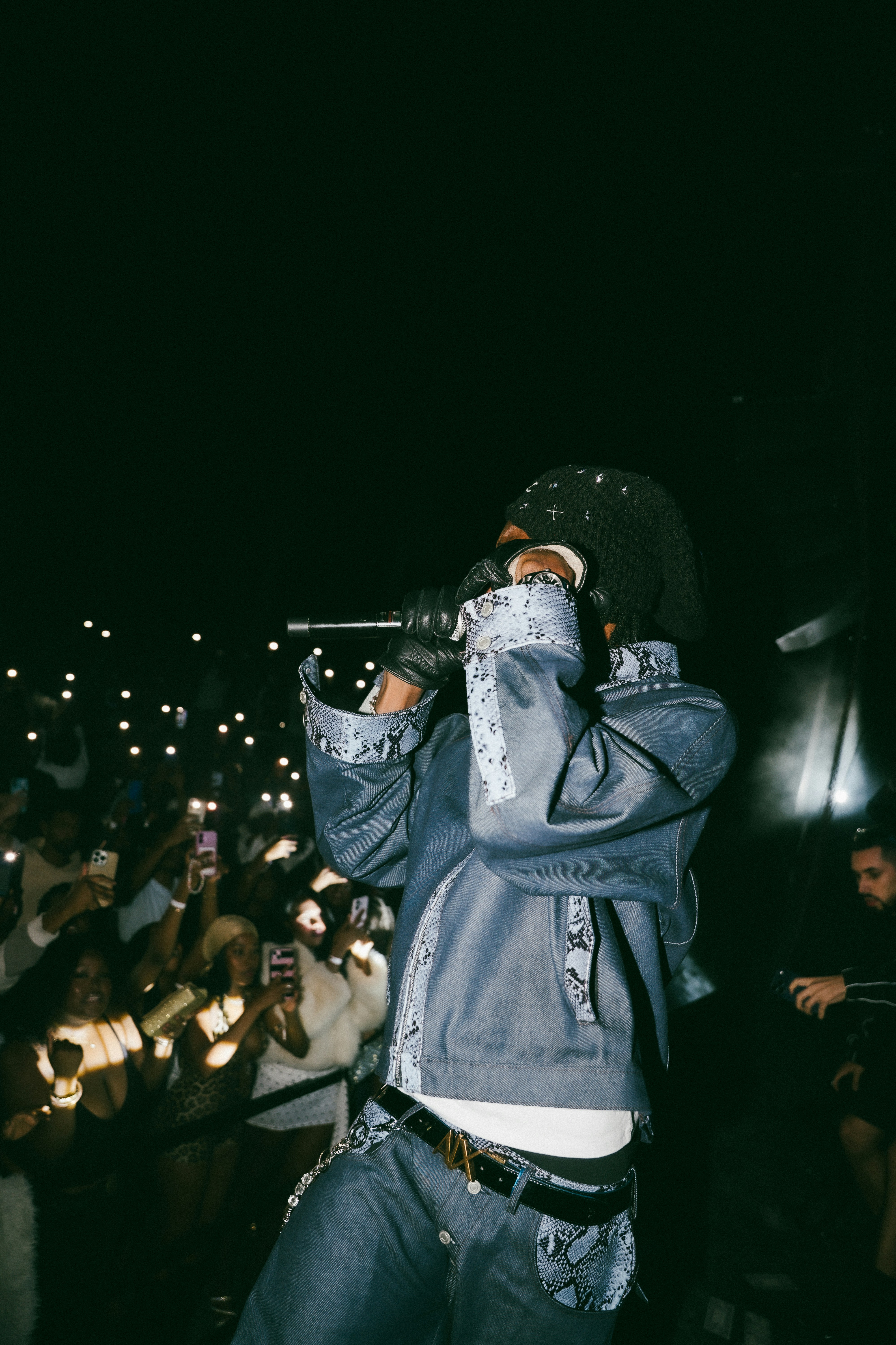 Performer in denim jacket on stage - Free Photo on Unsplash