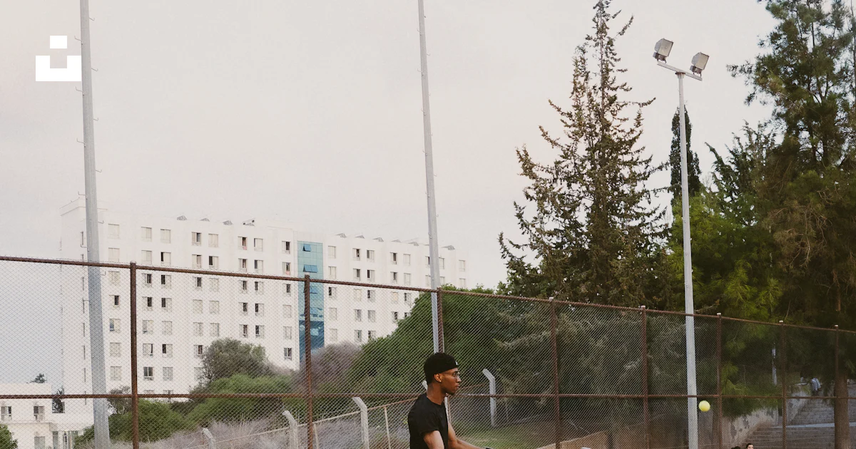 Red Man Safety Sign Man playing tennis on red court - Free Photo on Unsplash