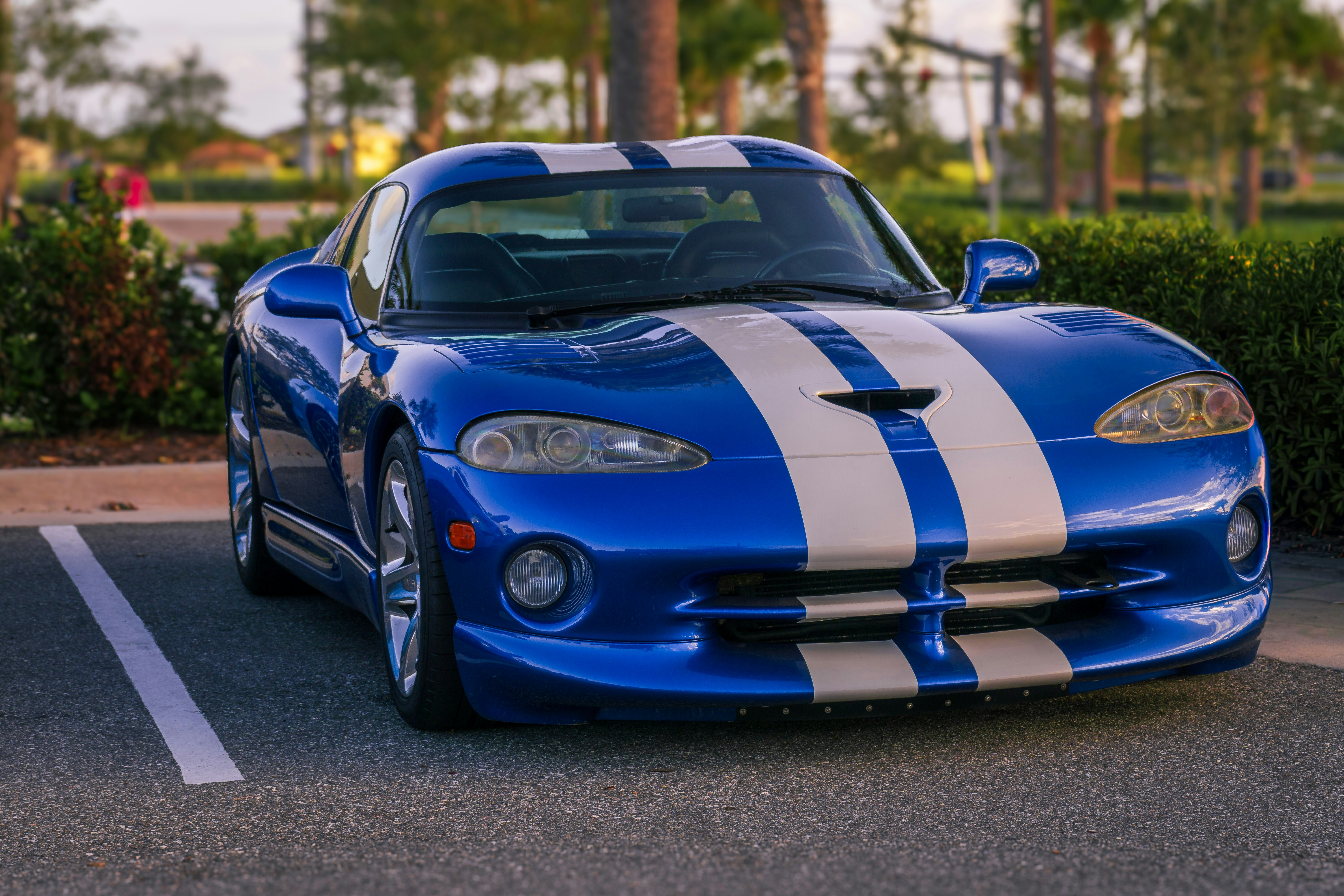 Blue sports car with white stripes - Free Photo on Unsplash