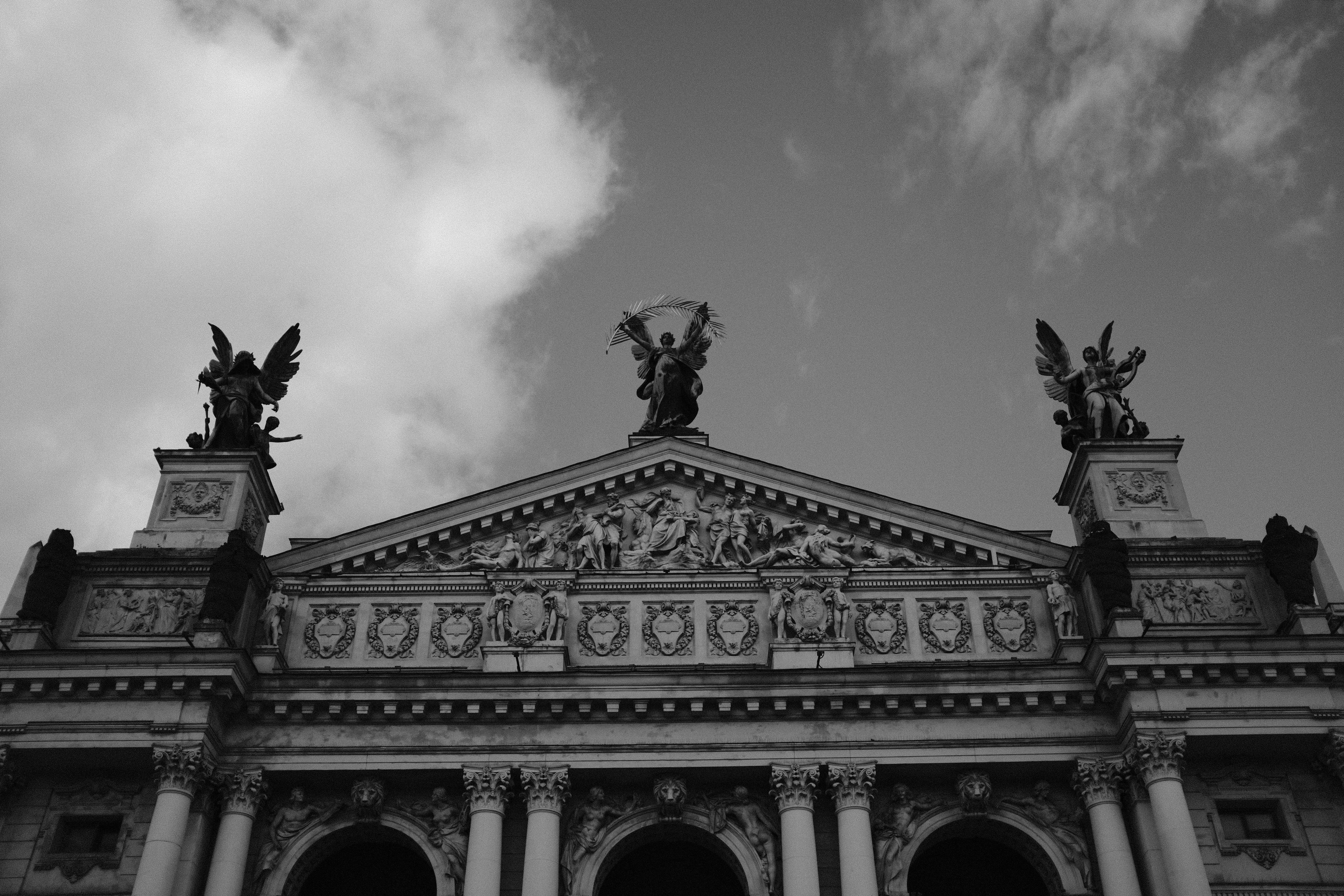 Lviv Opera House pediment with statues - Free Photo on Unsplash