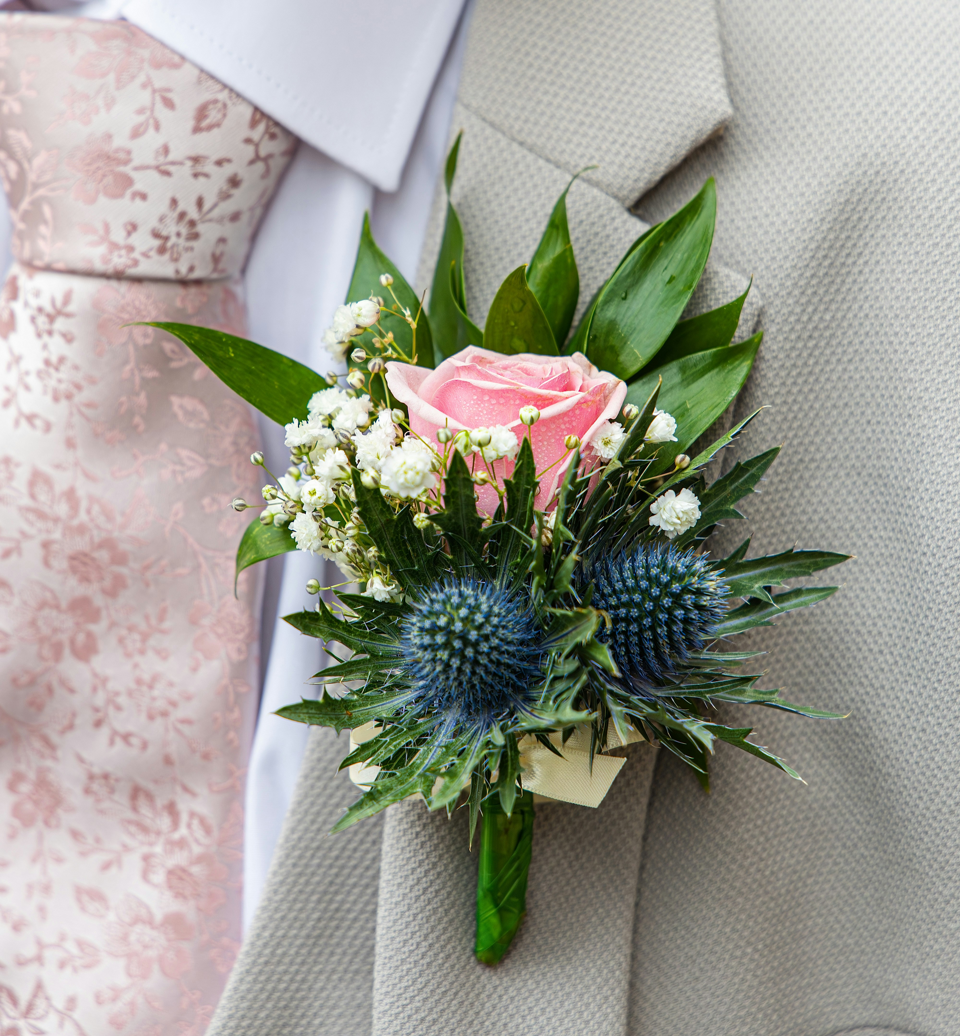 Pink rose boutonniere on beige suit - Free Photo on Unsplash