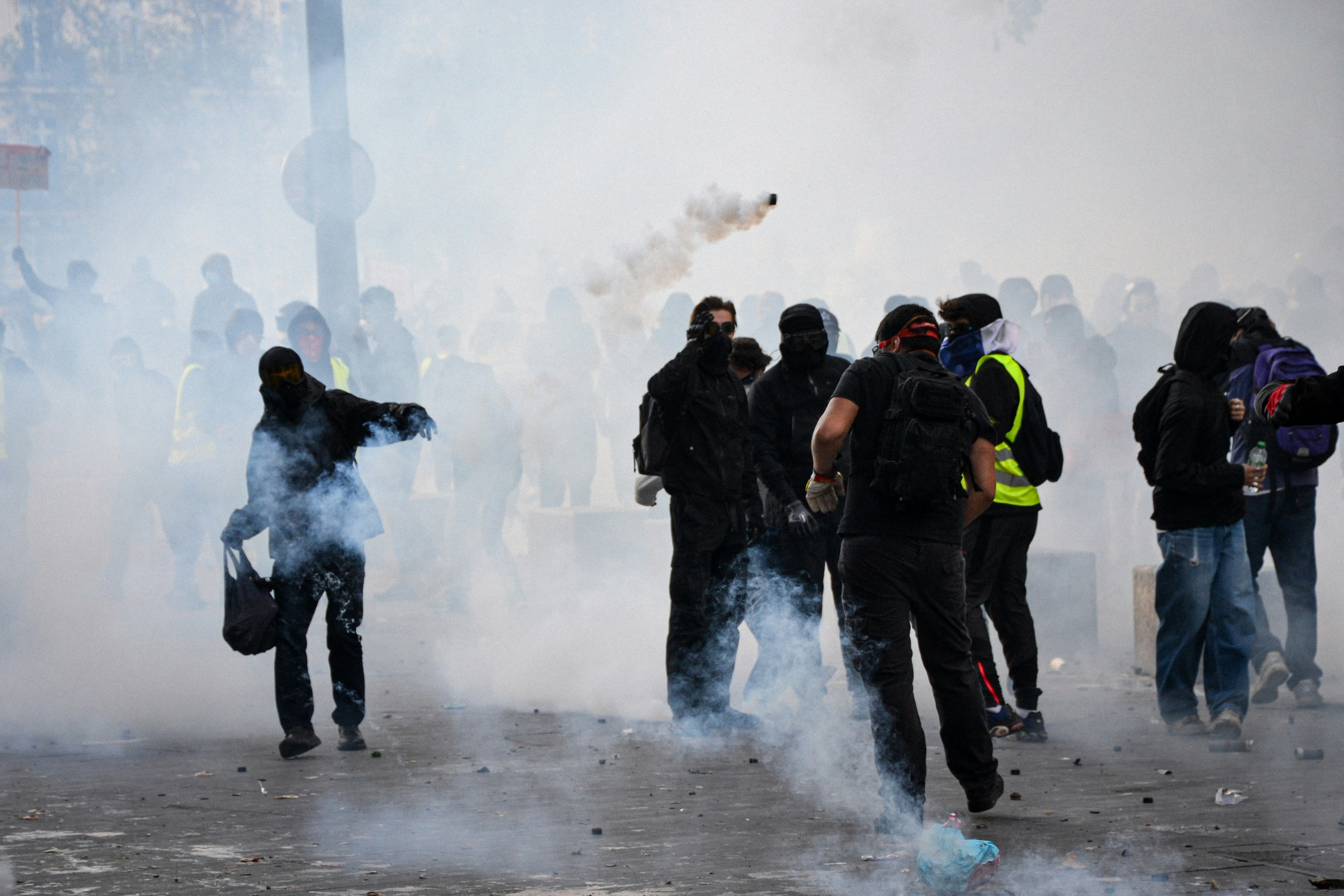 People in masks moving through smoke - Free Photo on Unsplash