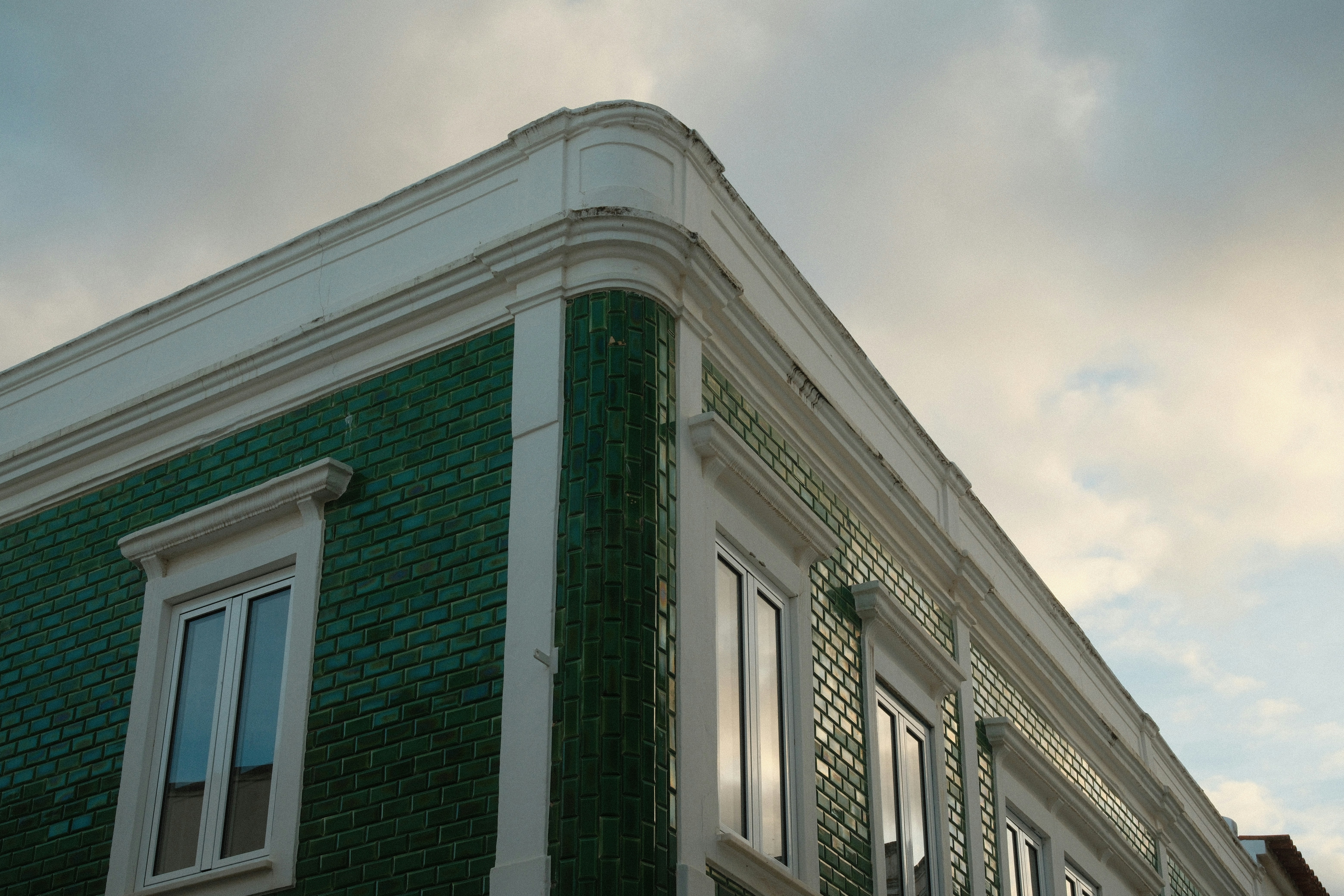 Building corner with green glazed tiles - Free Photo on Unsplash
