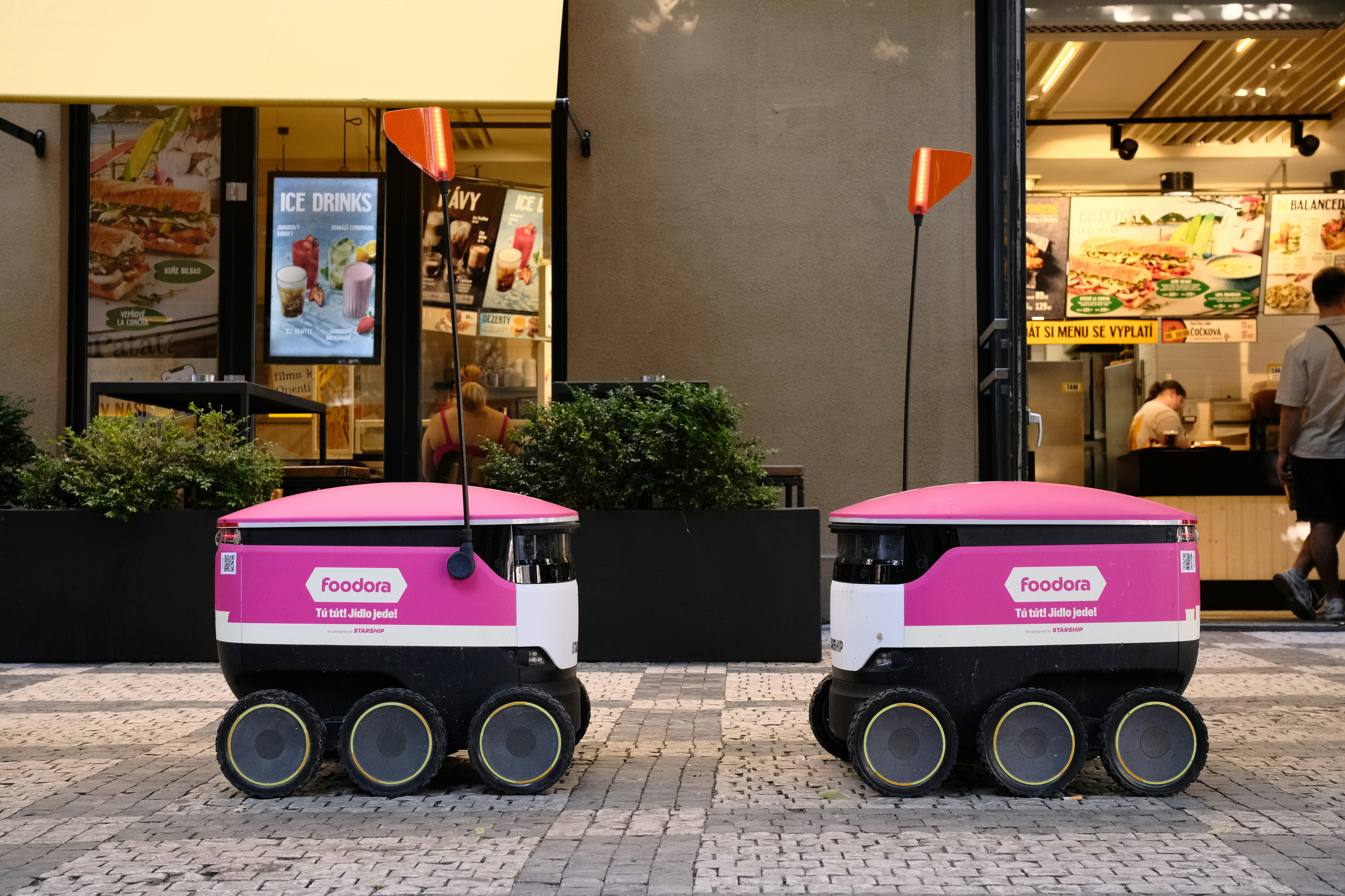 Two food delivery robots on street - Free Photo on Unsplash