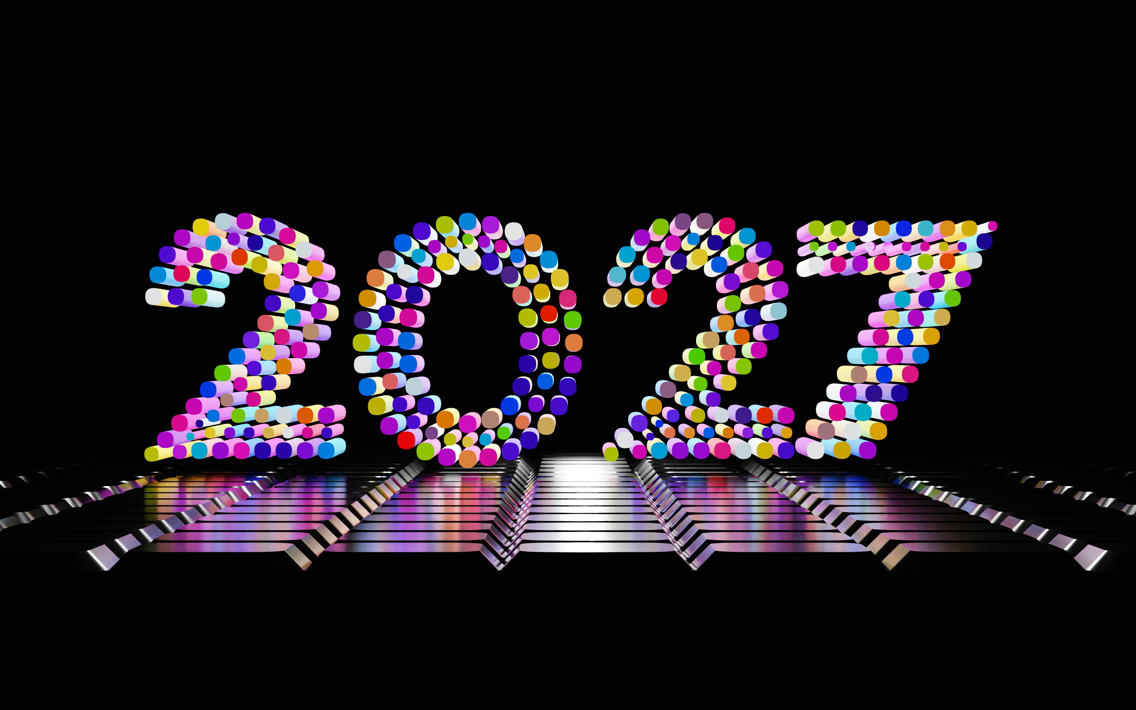 Colorful 2027 cylinders on reflective surface - Free Photo on Unsplash