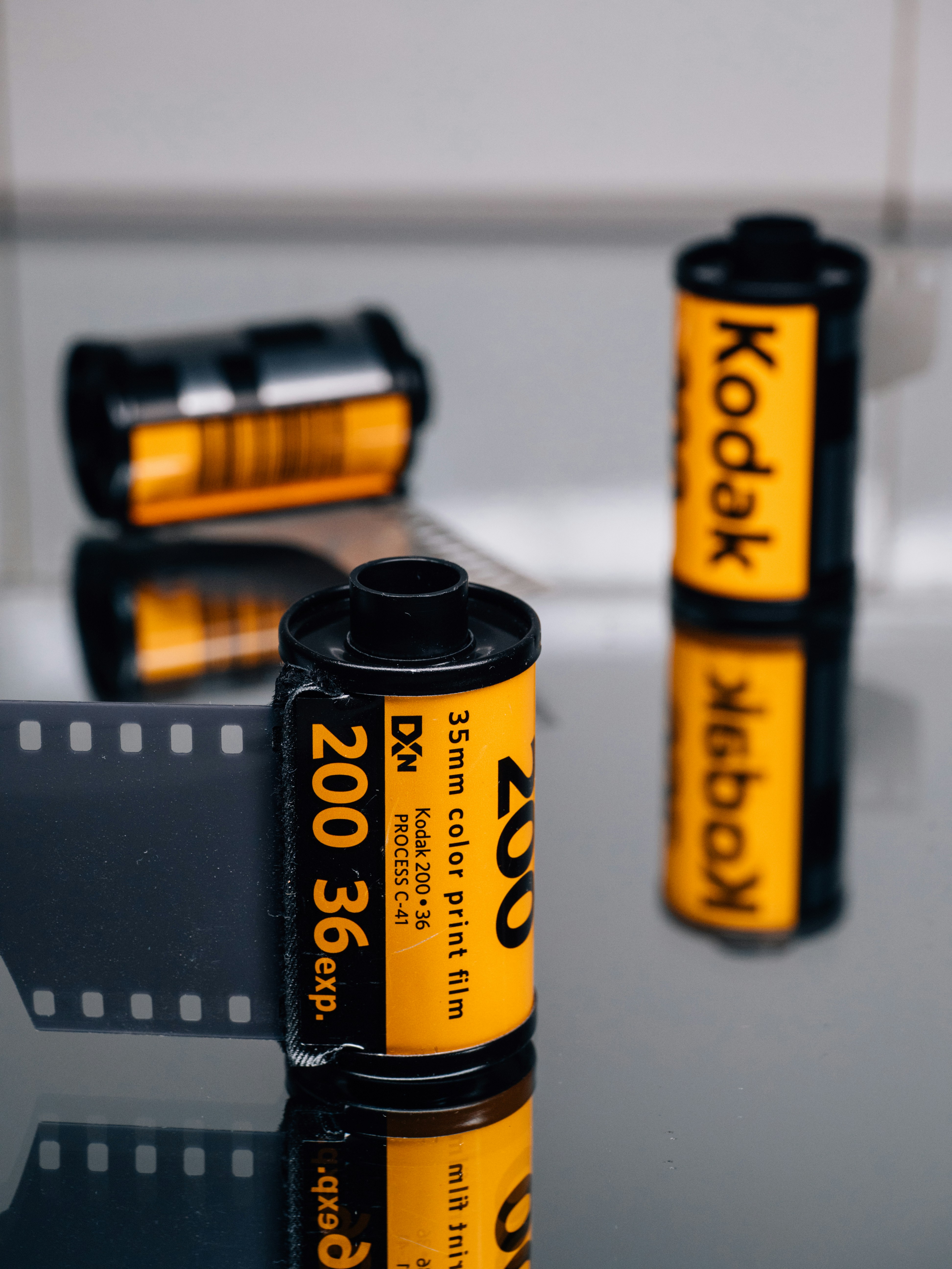 Kodak 35mm film rolls on surface - Free Photo on Unsplash