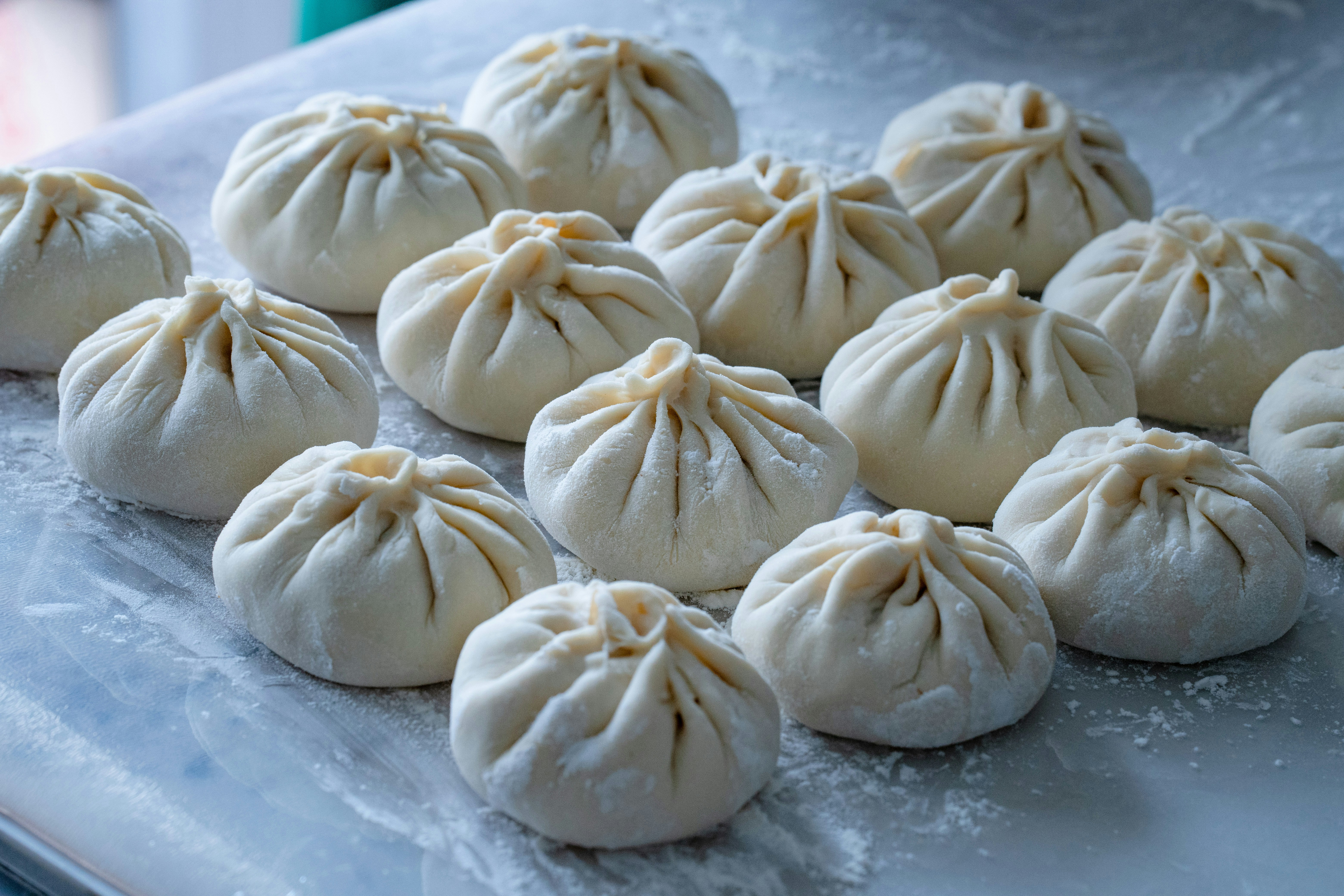 Raw pleated dough dumplings on surface - Free Photo on Unsplash