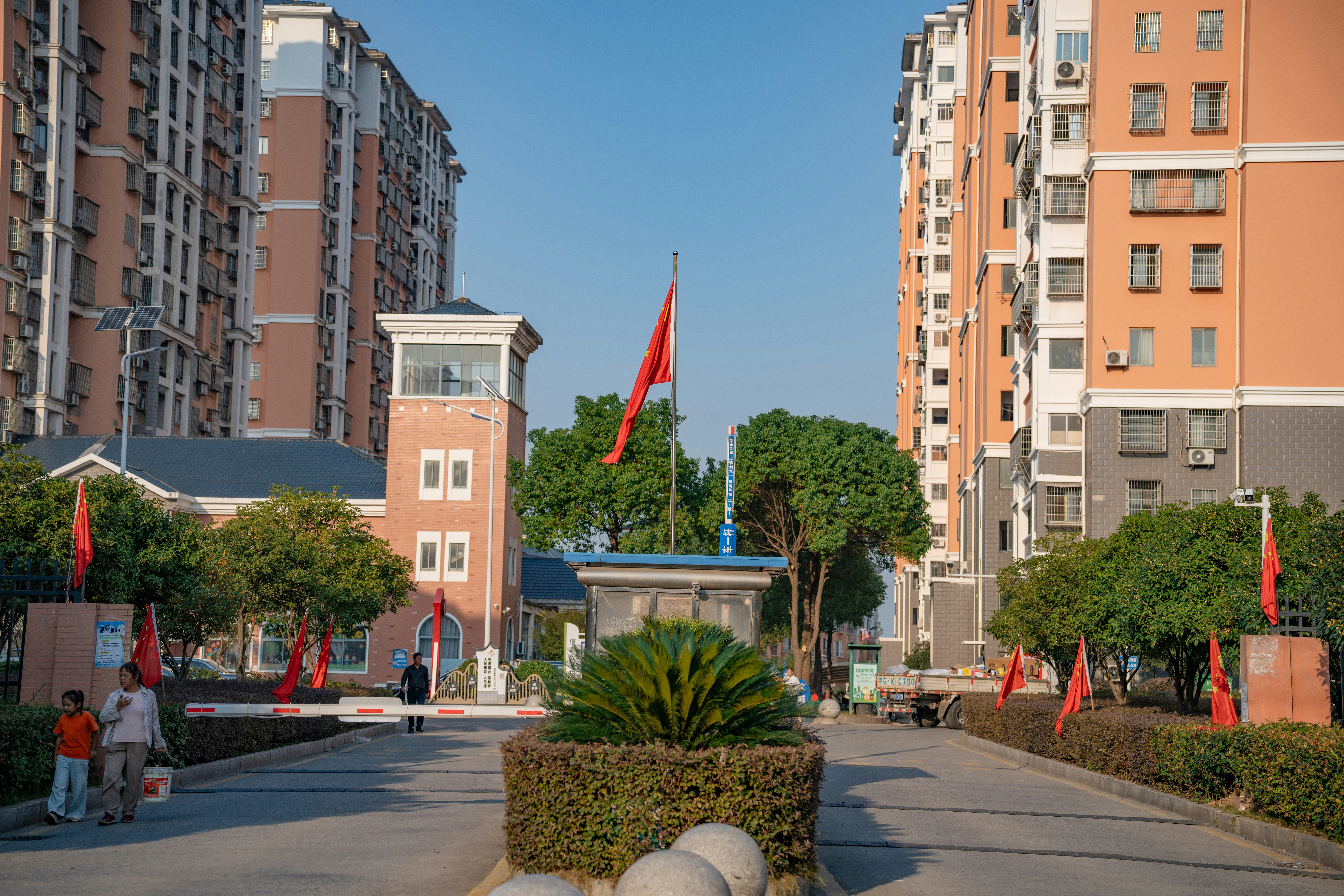 Residential complex entrance with flags - Free Photo on Unsplash