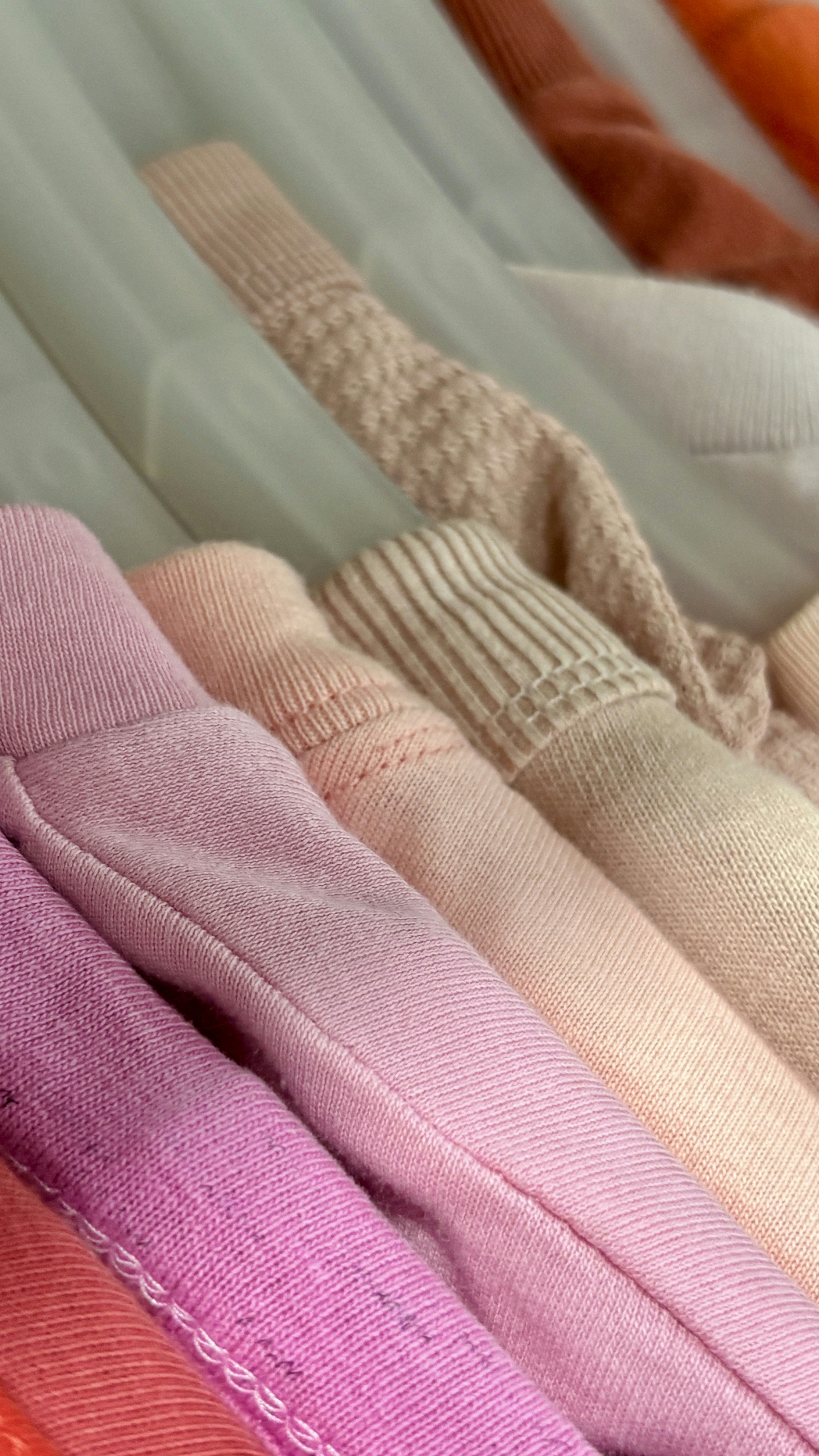Folded t-shirts in pink gradient - Free Photo on Unsplash