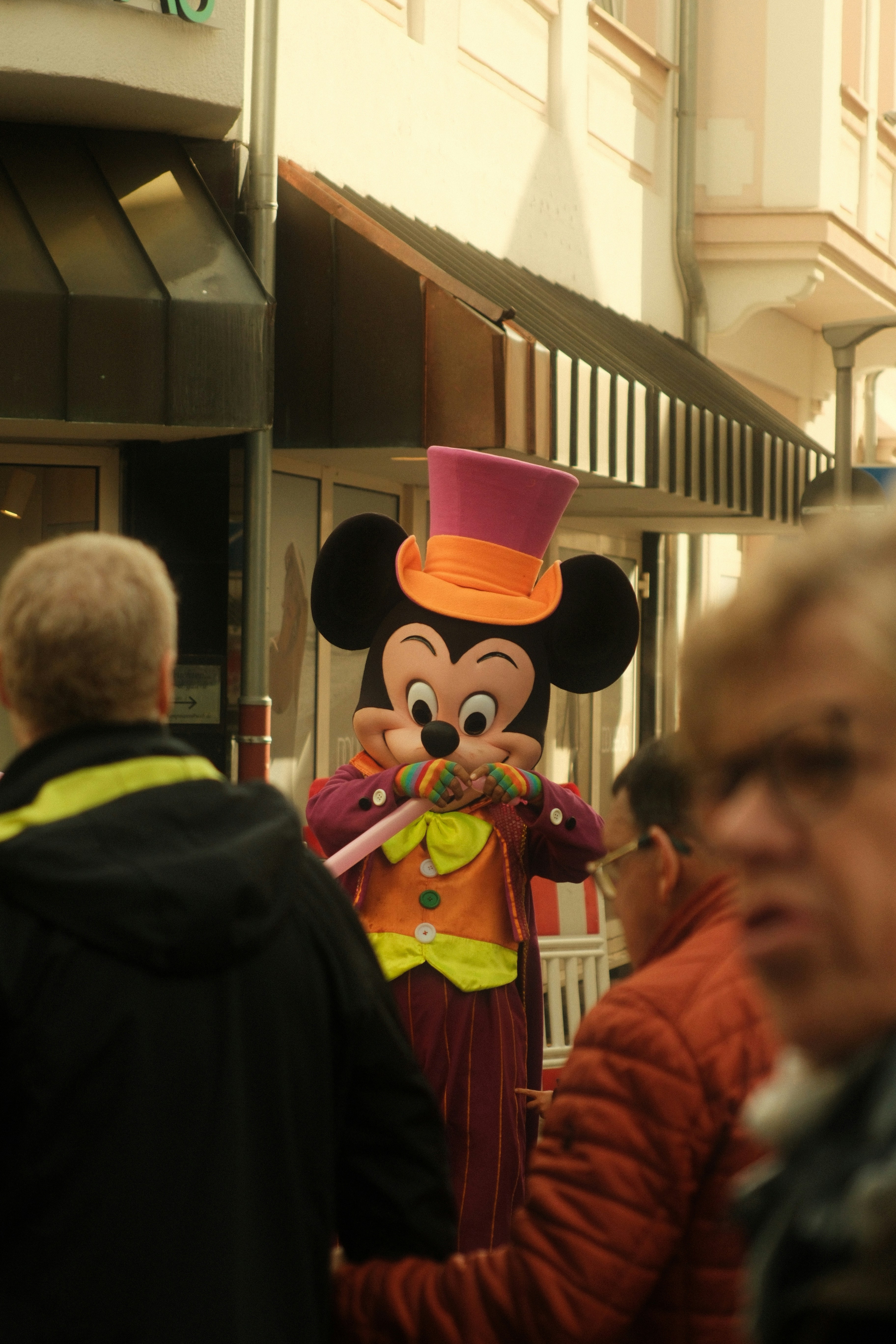 Mickey Mouse costume on city street - Free Photo on Unsplash