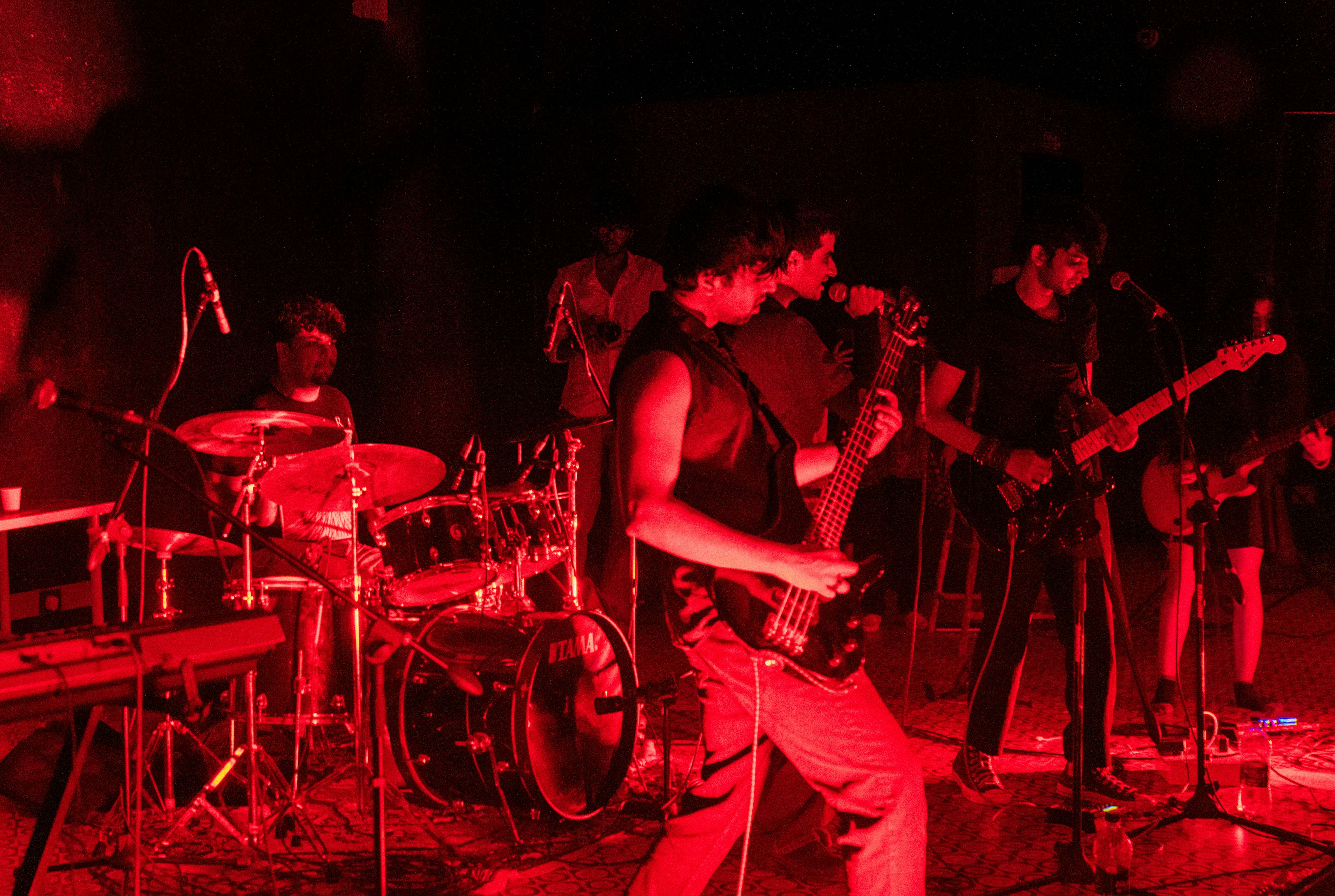 Band performing on stage in red - Free Photo on Unsplash