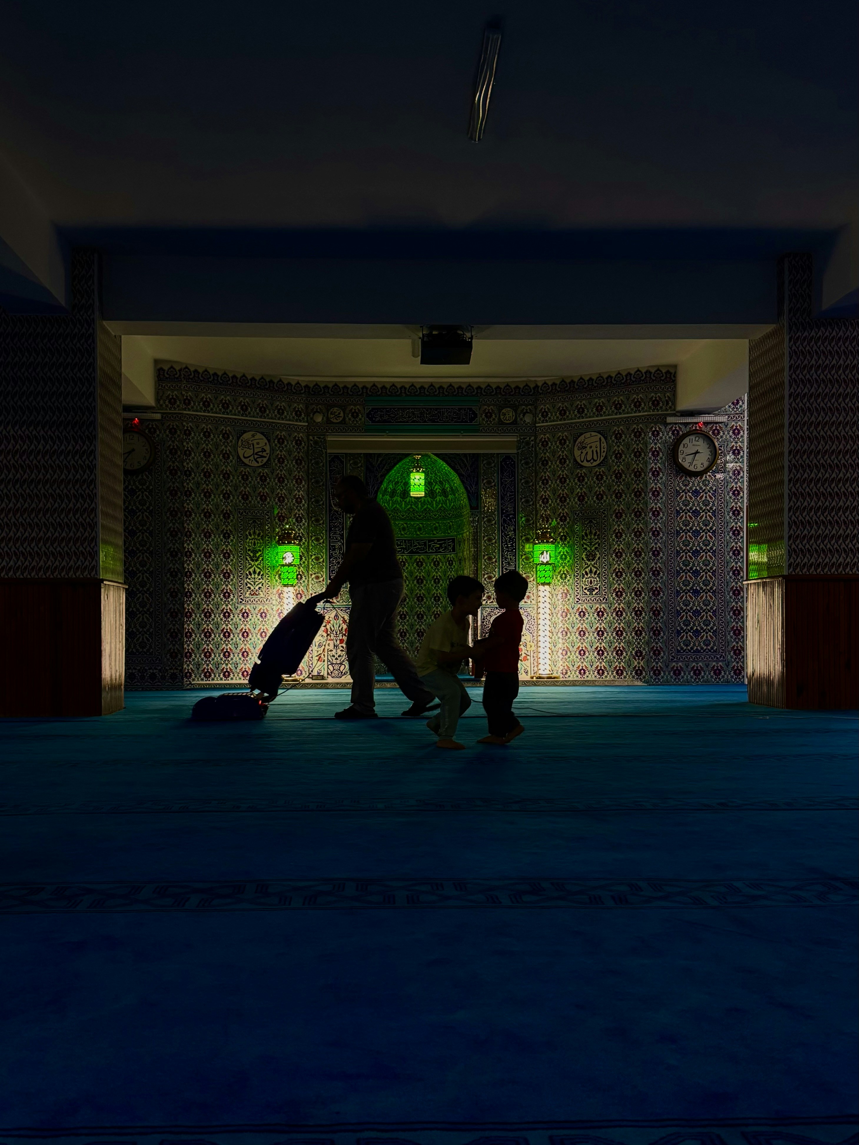 Adult vacuuming carpet in mosque - Free Photo on Unsplash