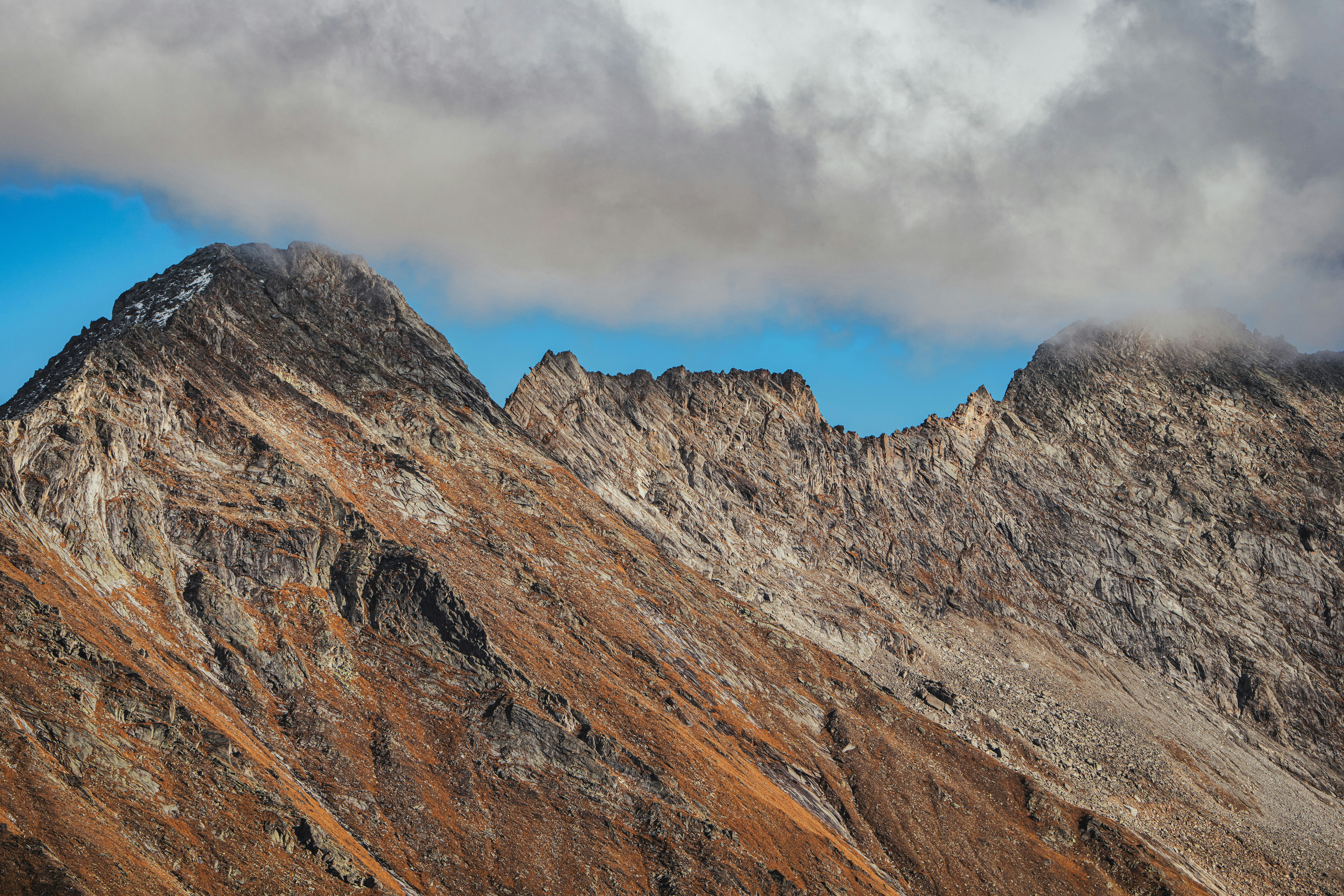 Rugged mountain peaks with orange slopes - Free Photo on Unsplash