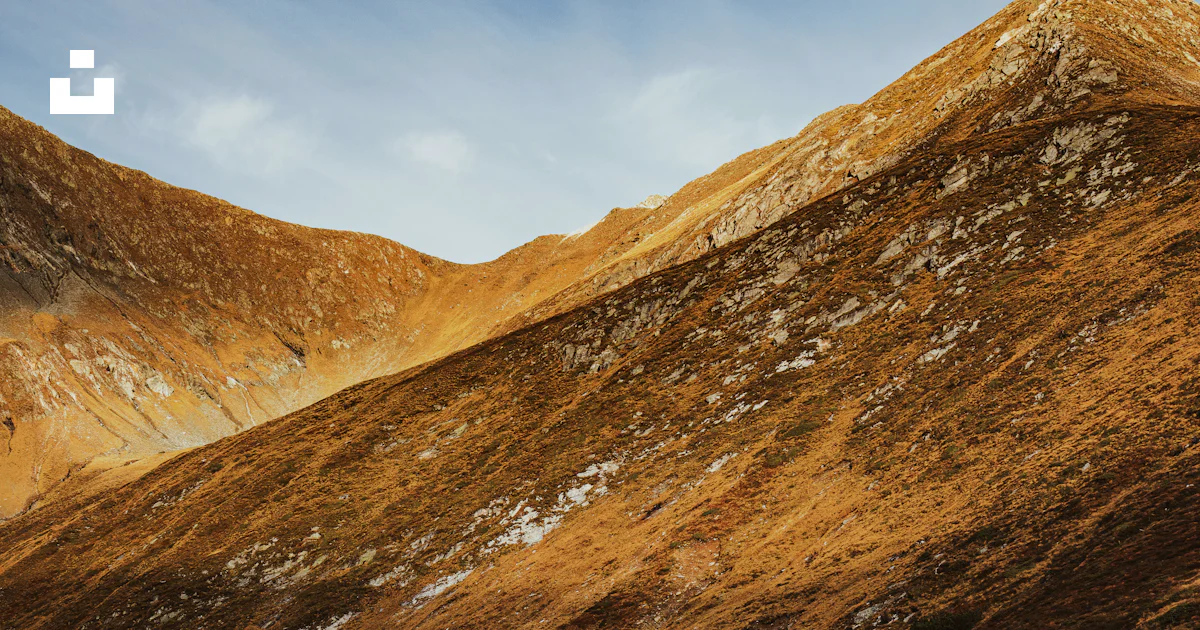Sloping Icon Golden mountain slope above alpine lake - Free Photo on Unsplash