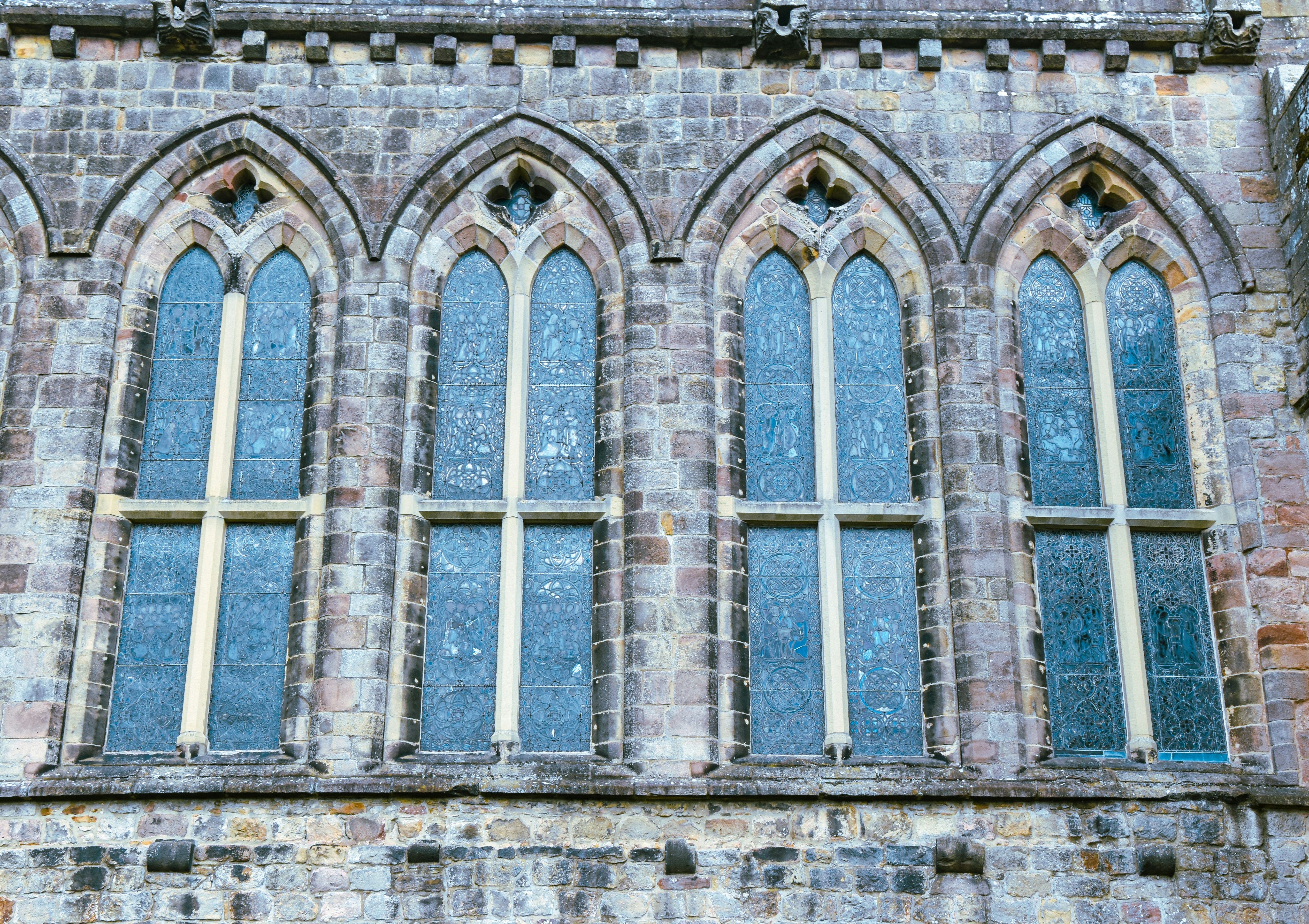 Arched stained glass windows in stone - Free Photo on Unsplash