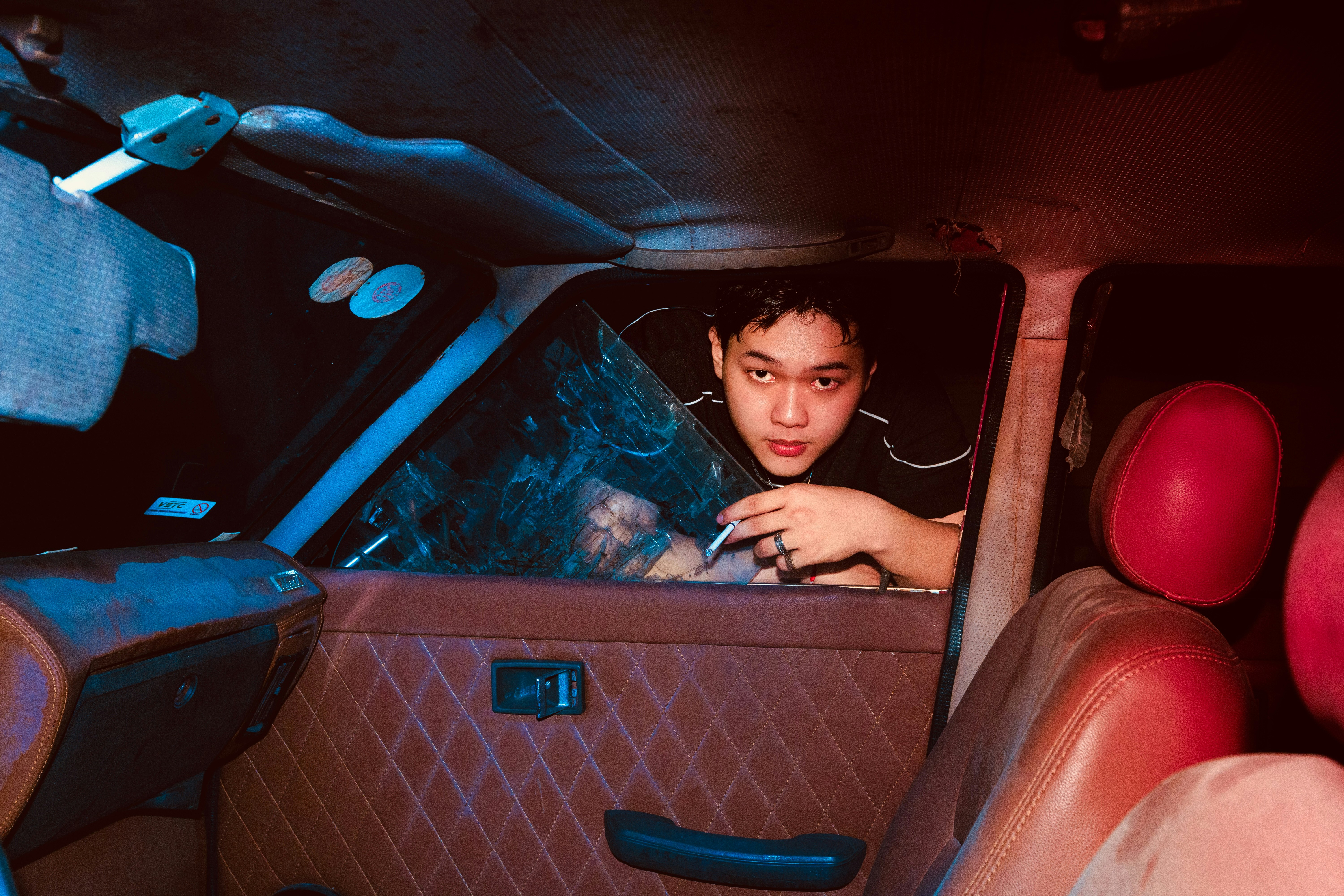 Person with cigarette in car window - Free Photo on Unsplash