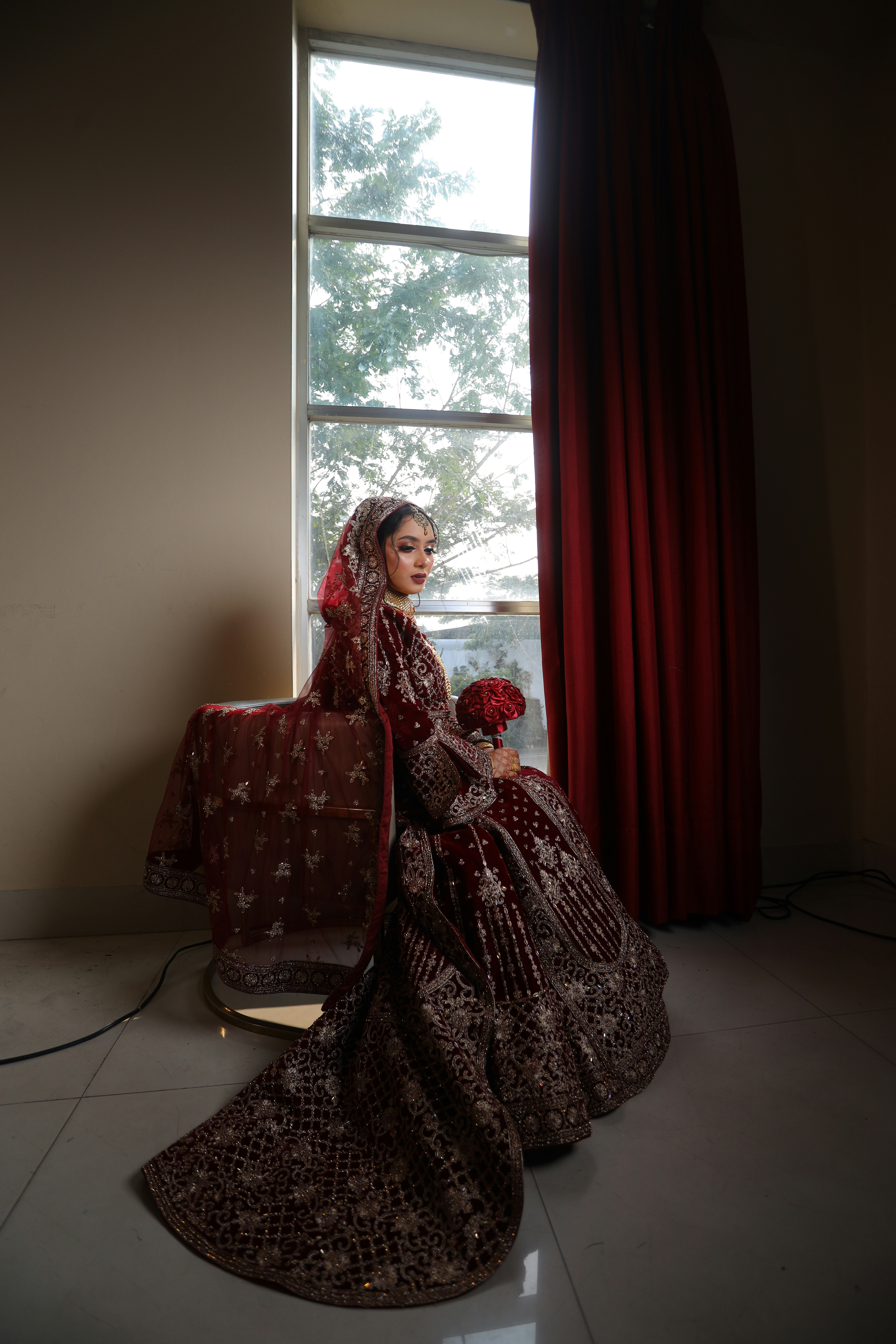 A bride by a window in soft light
