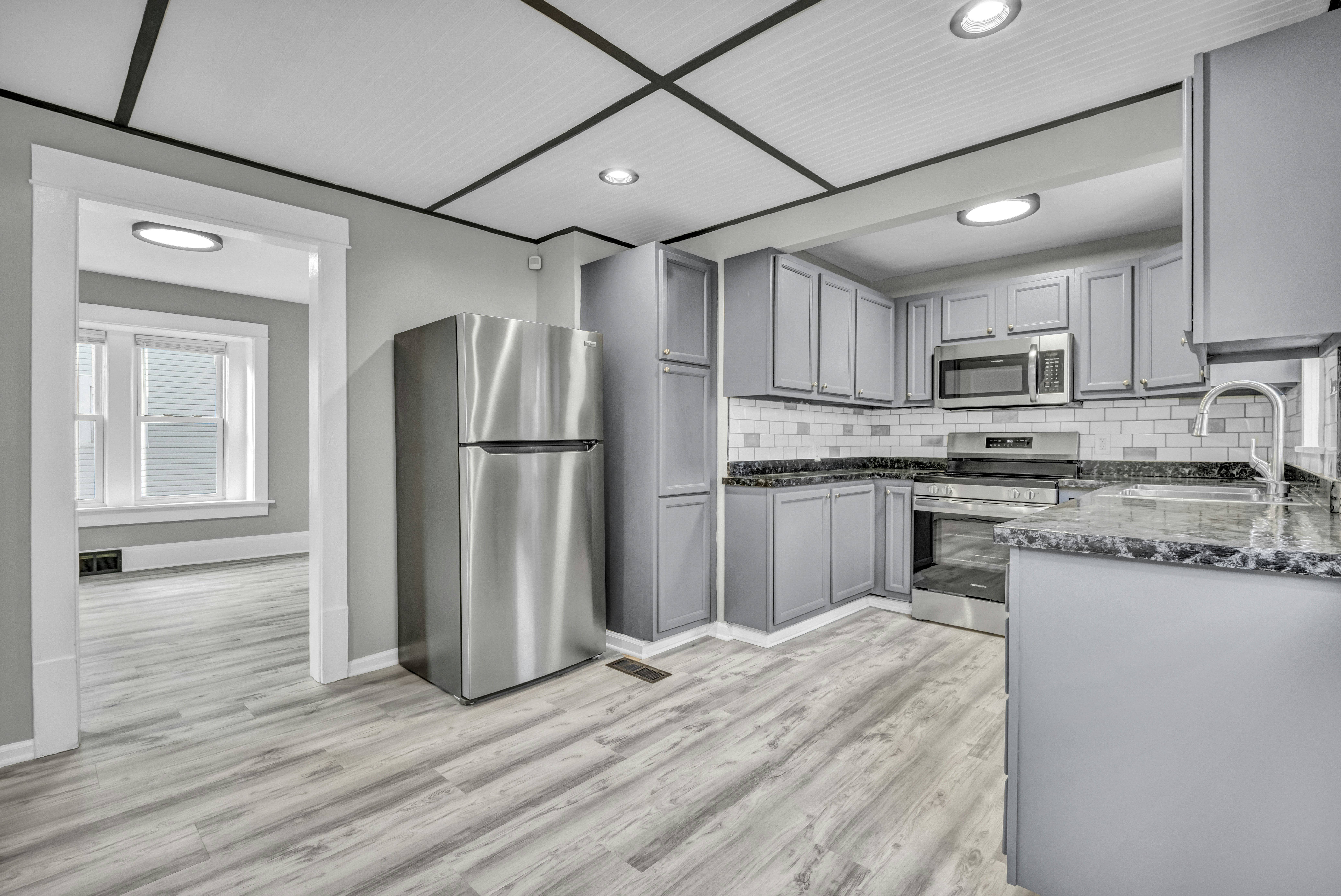 Modern kitchen with grey cabinets - Free Photo on Unsplash