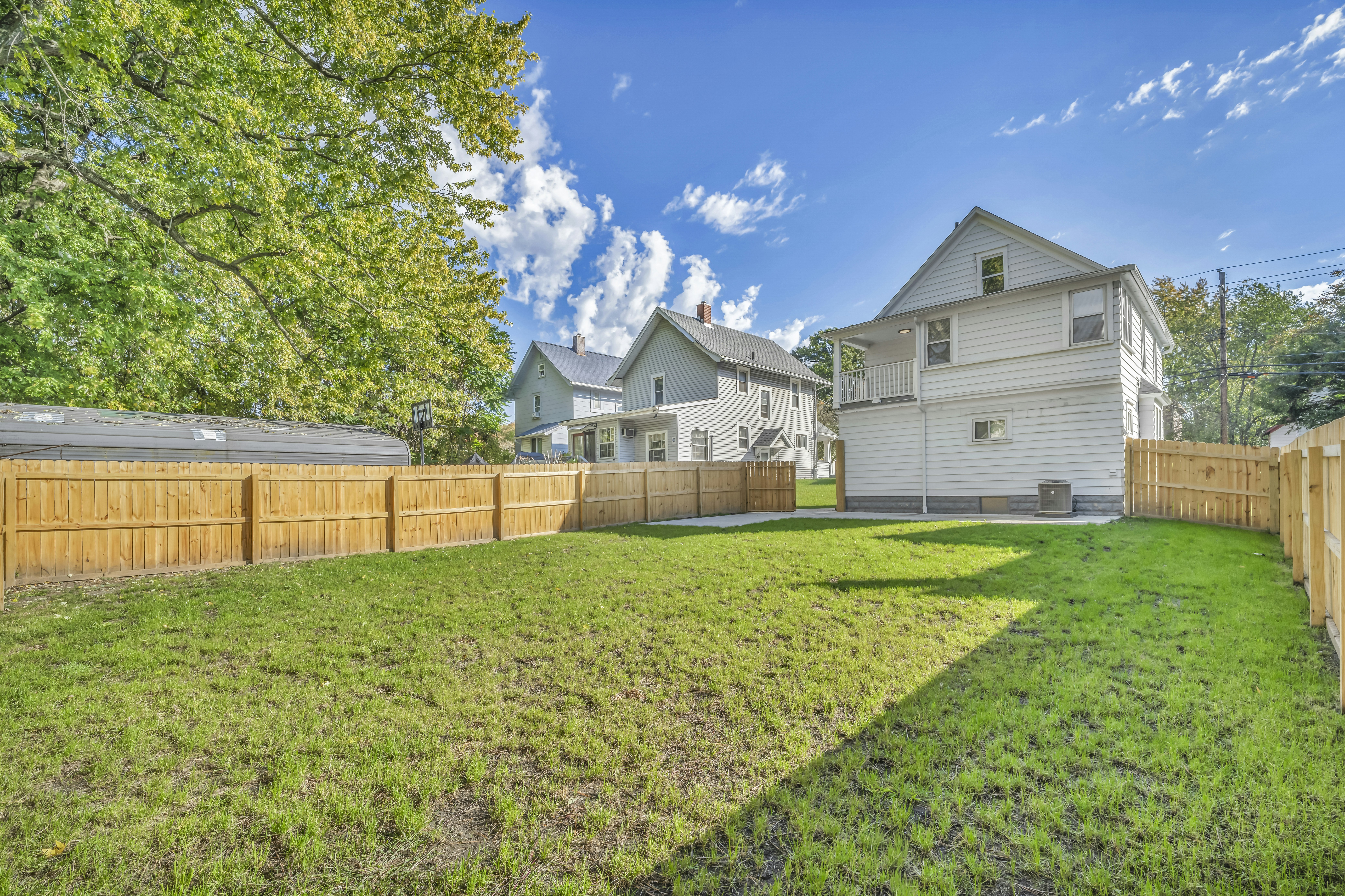 Backyard with wooden fence and houses - Free Photo on Unsplash