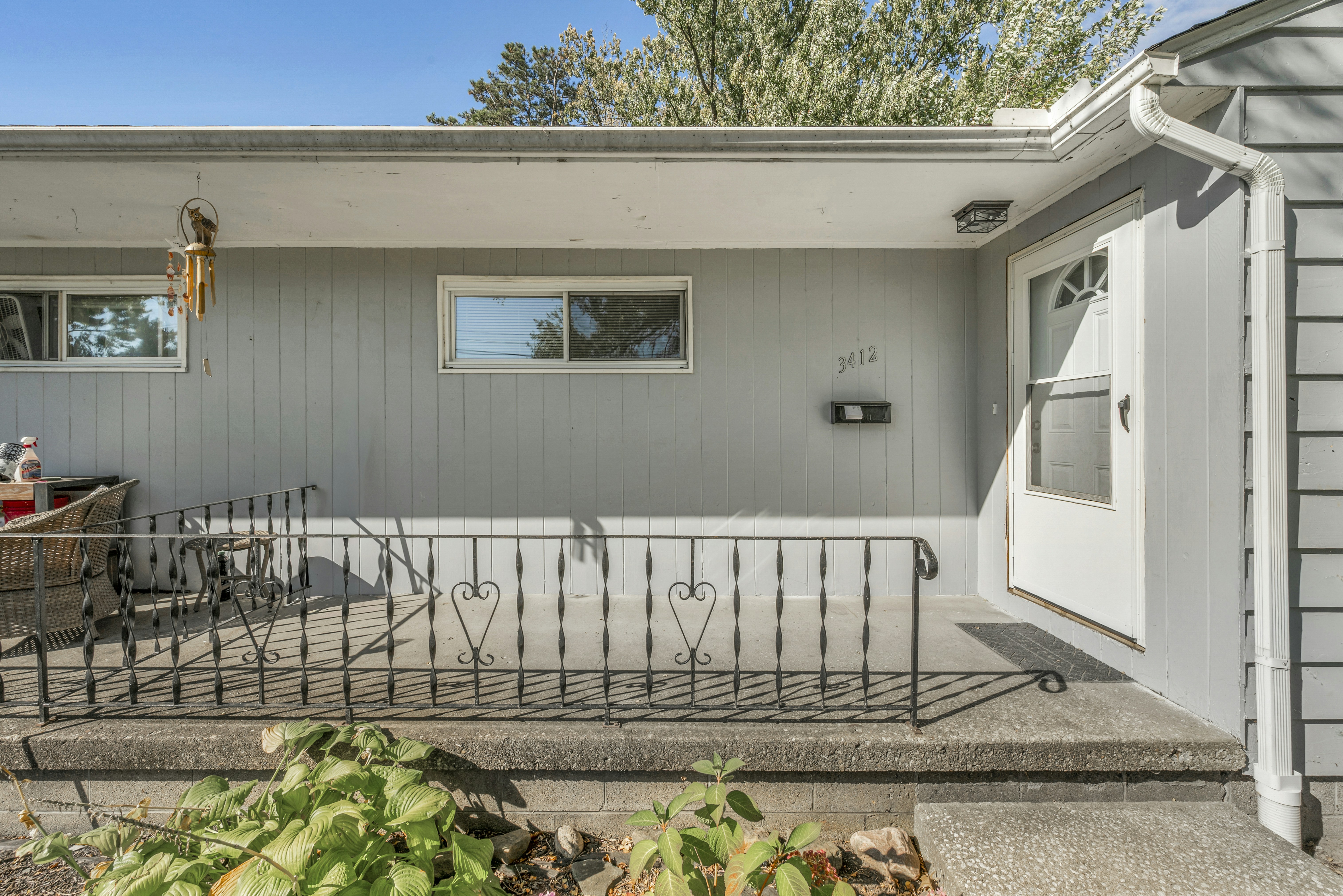Grey house exterior with concrete porch - Free Photo on Unsplash