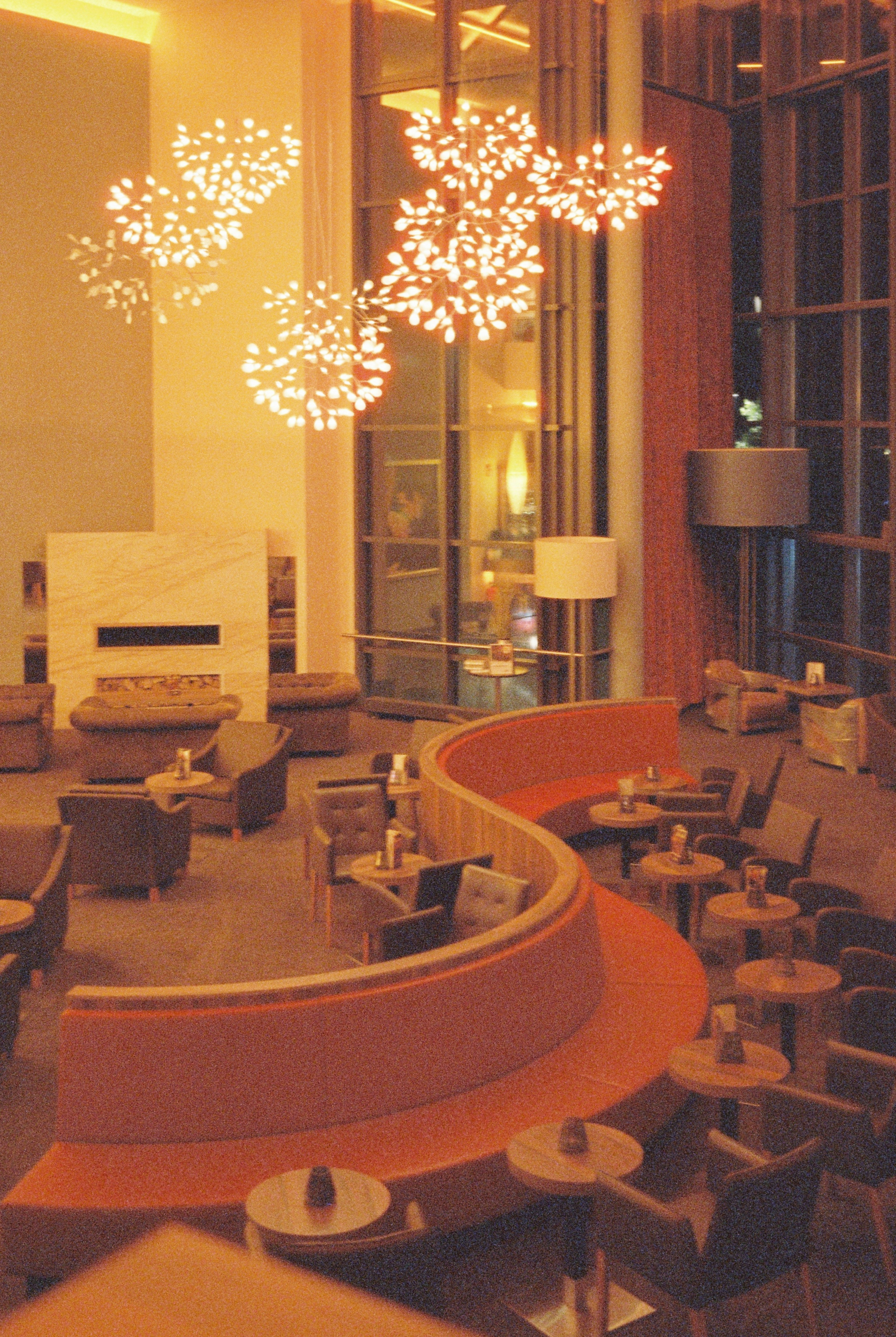 Curved orange sofa in hotel lounge - Free Photo on Unsplash