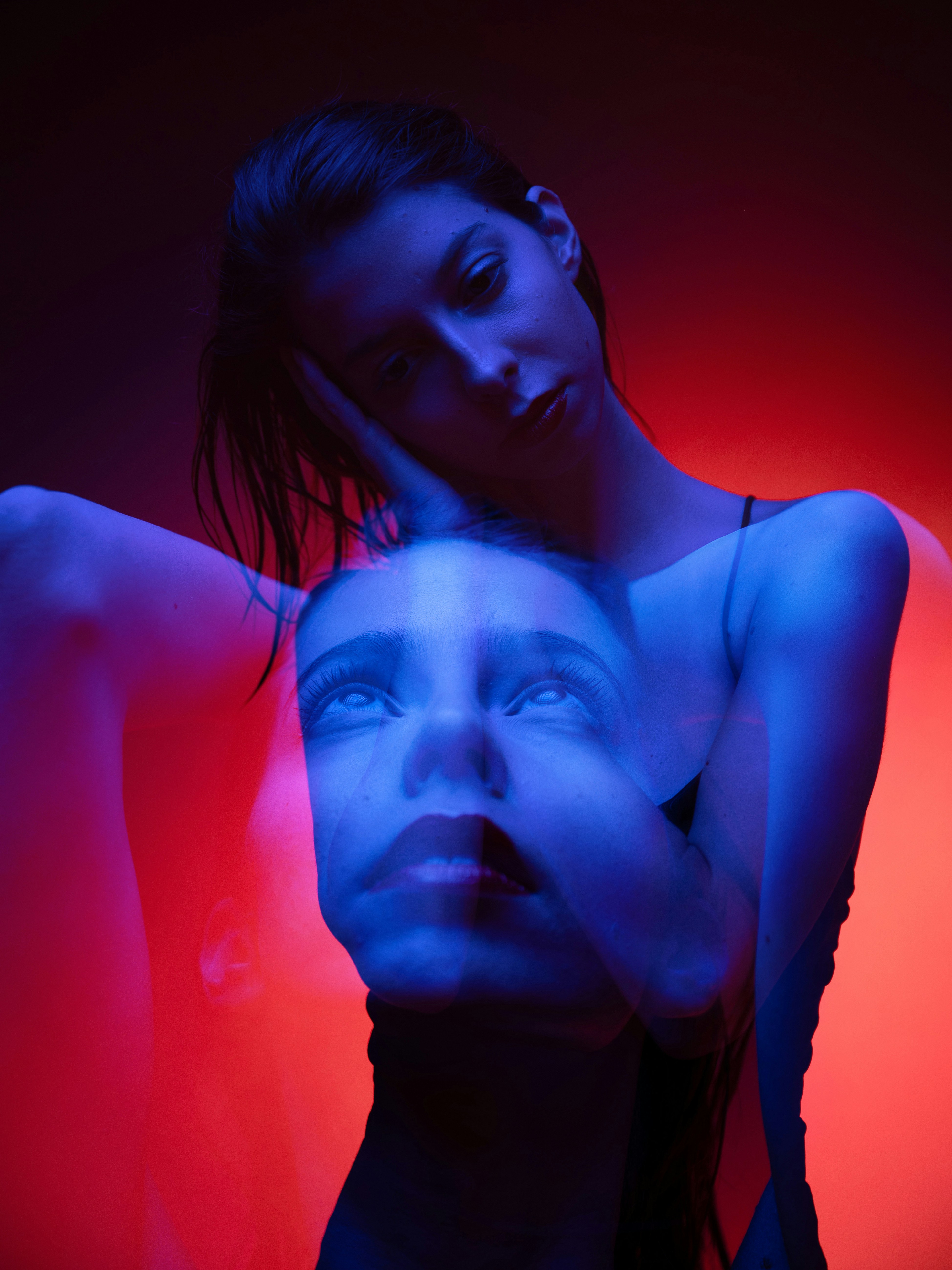 A double exposure portrait of a woman in blue and red neon light - 相关推荐