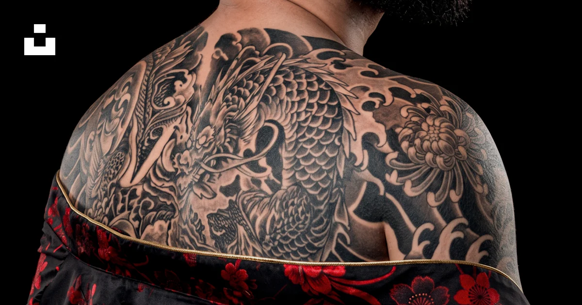 Red Man Safety Sign Man with dragon back tattoo - Free Photo on Unsplash