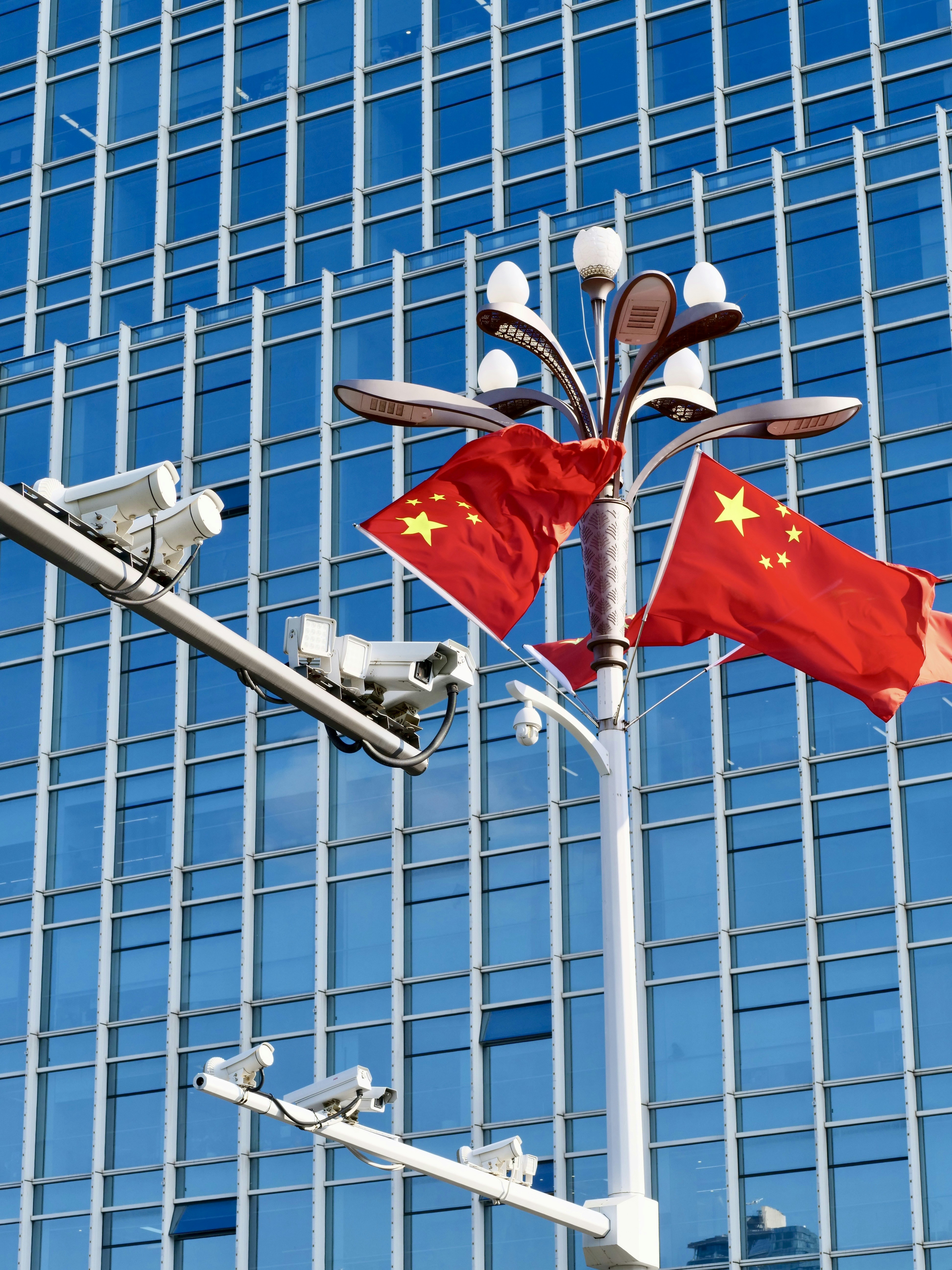 Chinese flags and security cameras - Free Photo on Unsplash