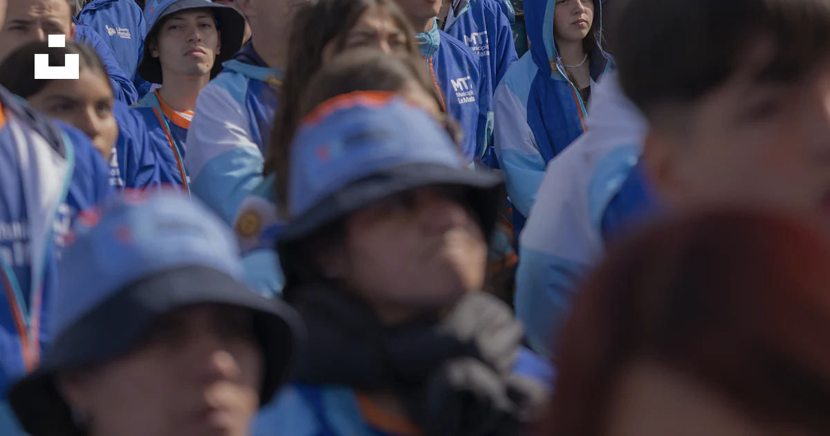 Crowd Watching Camera Crowd wearing blue and white hats - Free Photo on Unsplash