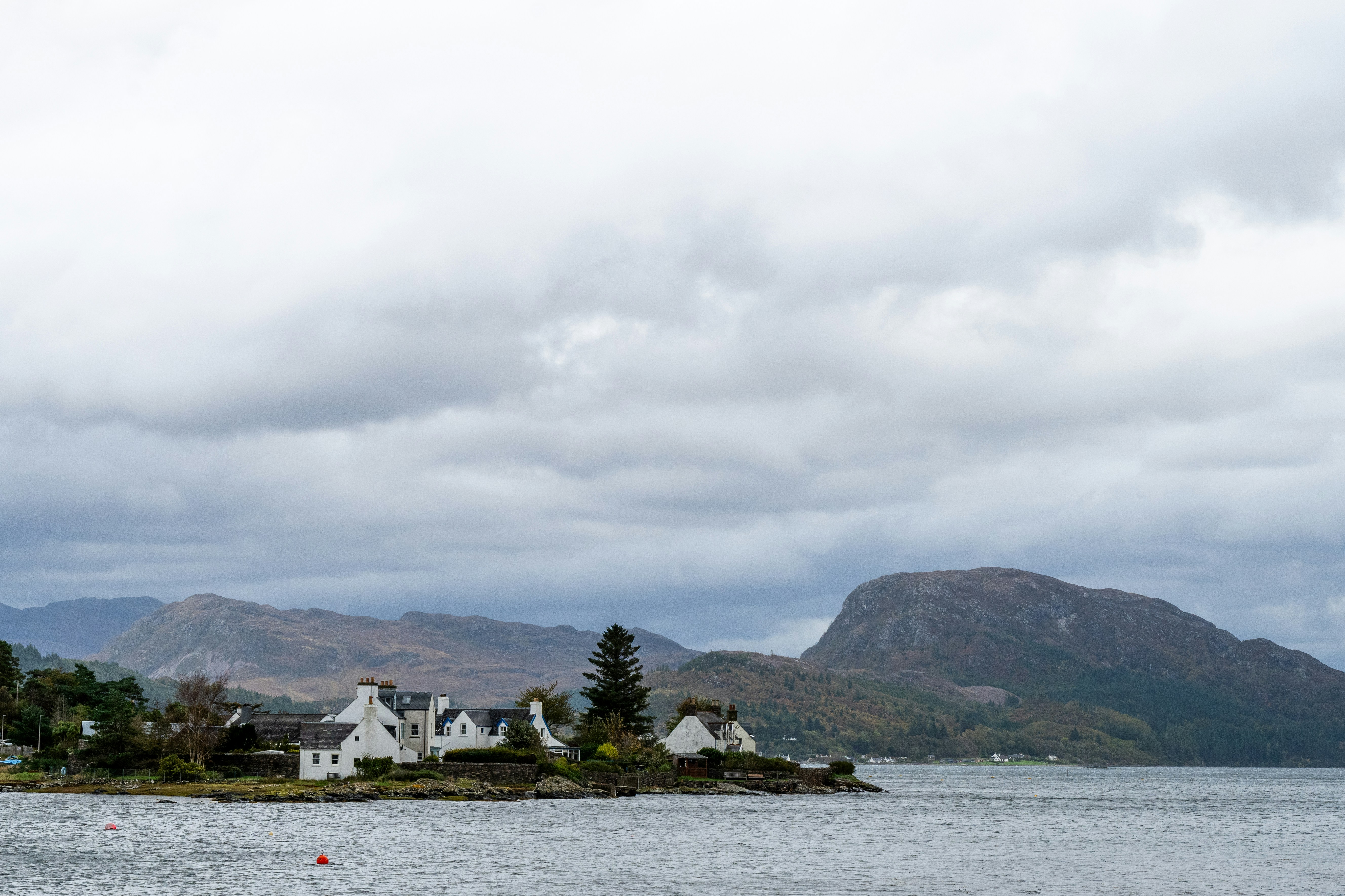 White cottages on rocky shoreline - Free Photo on Unsplash