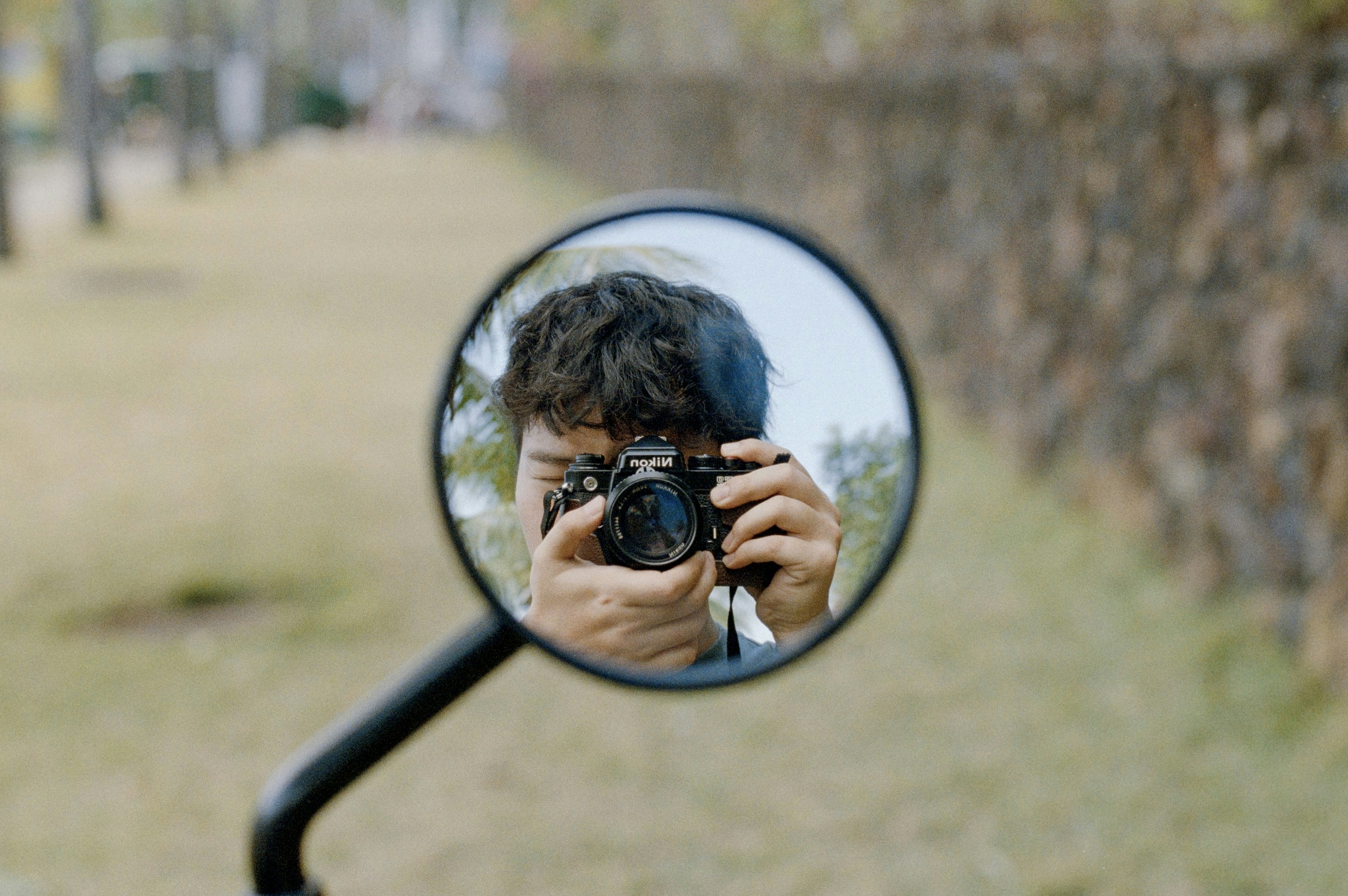 Person holding camera in motorcycle mirror - Free Photo on Unsplash