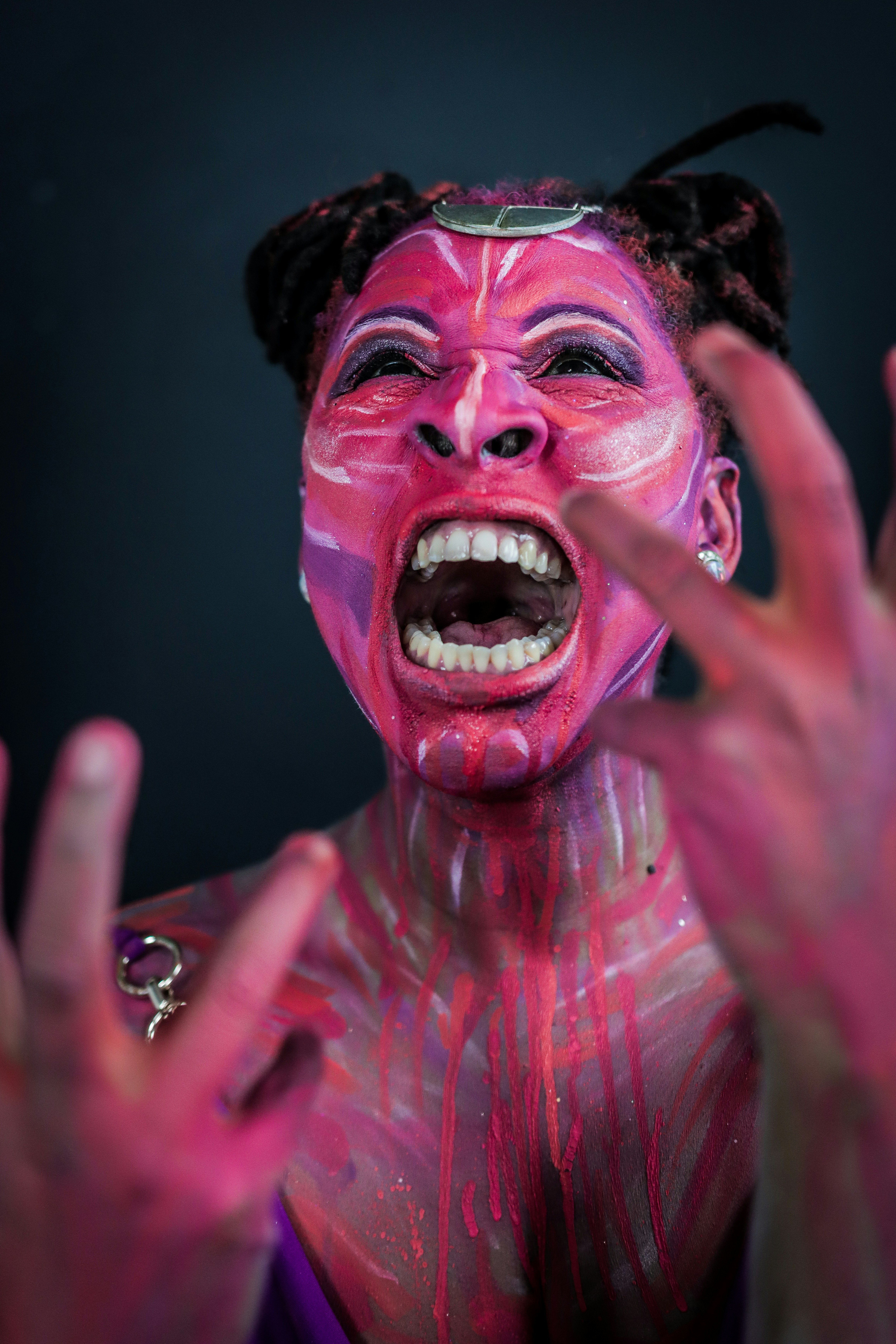 Person with pink face paint shouting - Free Photo on Unsplash