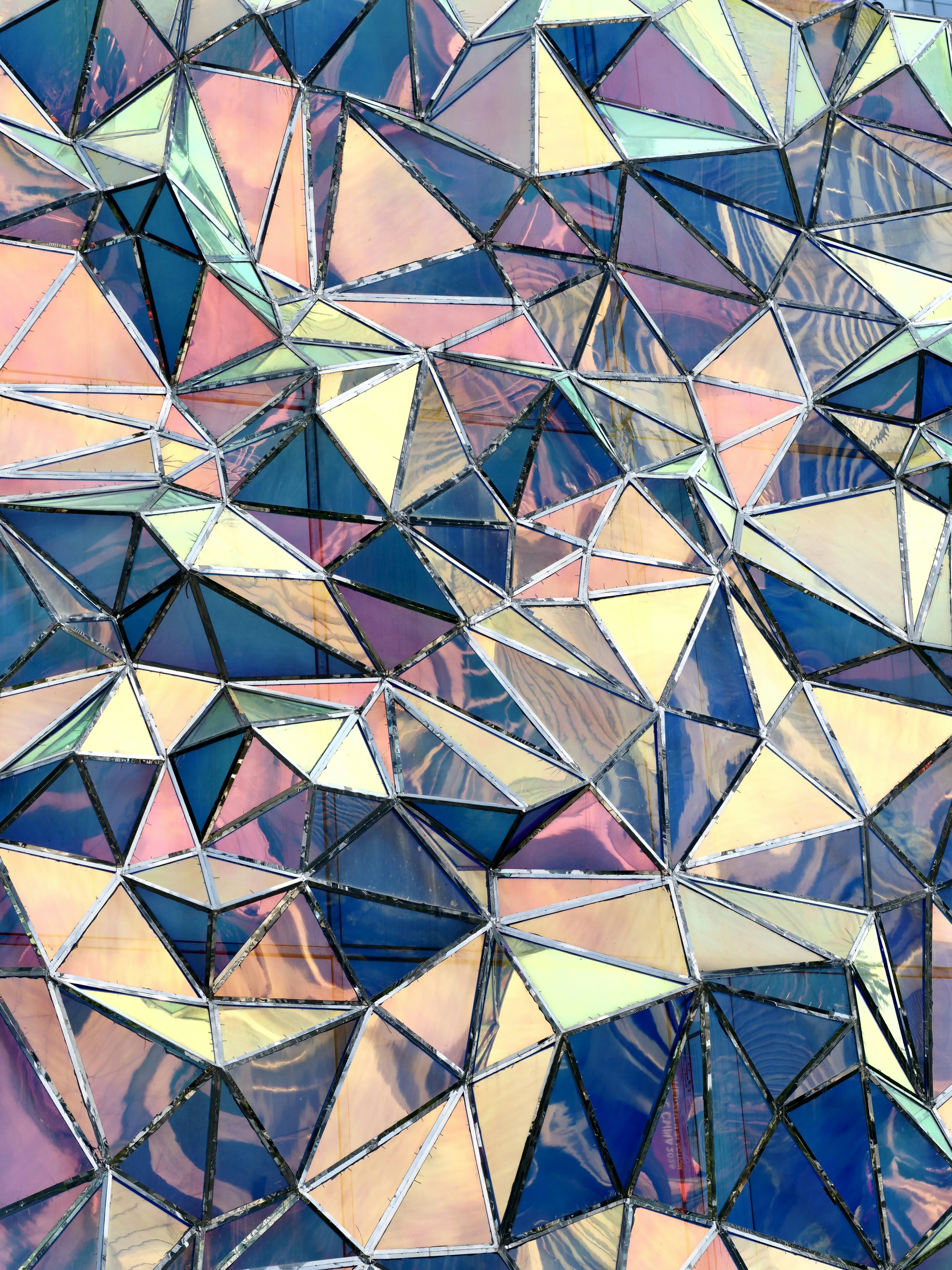 Iridescent glass triangle geometric surface - Free Photo on Unsplash