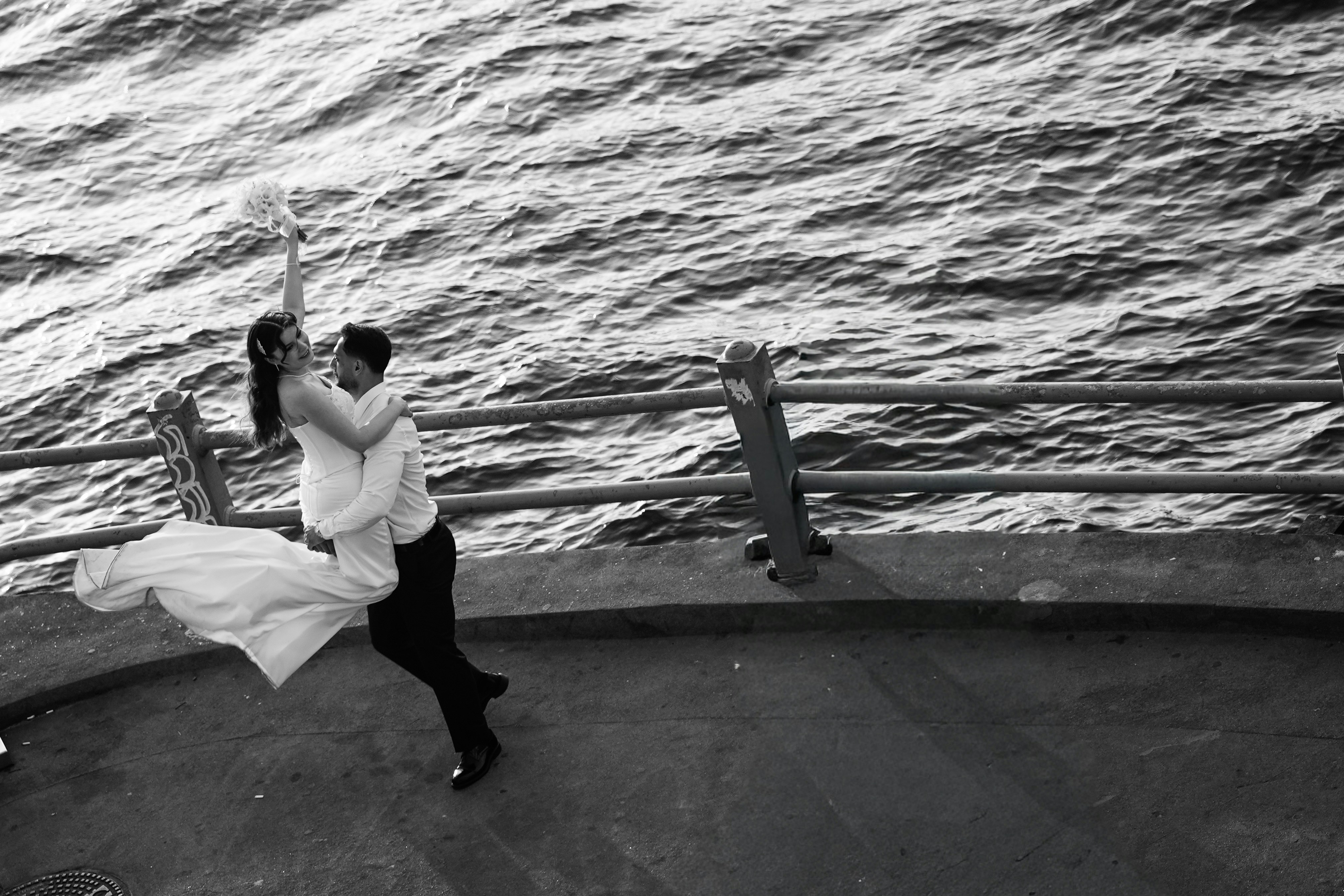 Bride and groom by waterfront railing - Free Photo on Unsplash