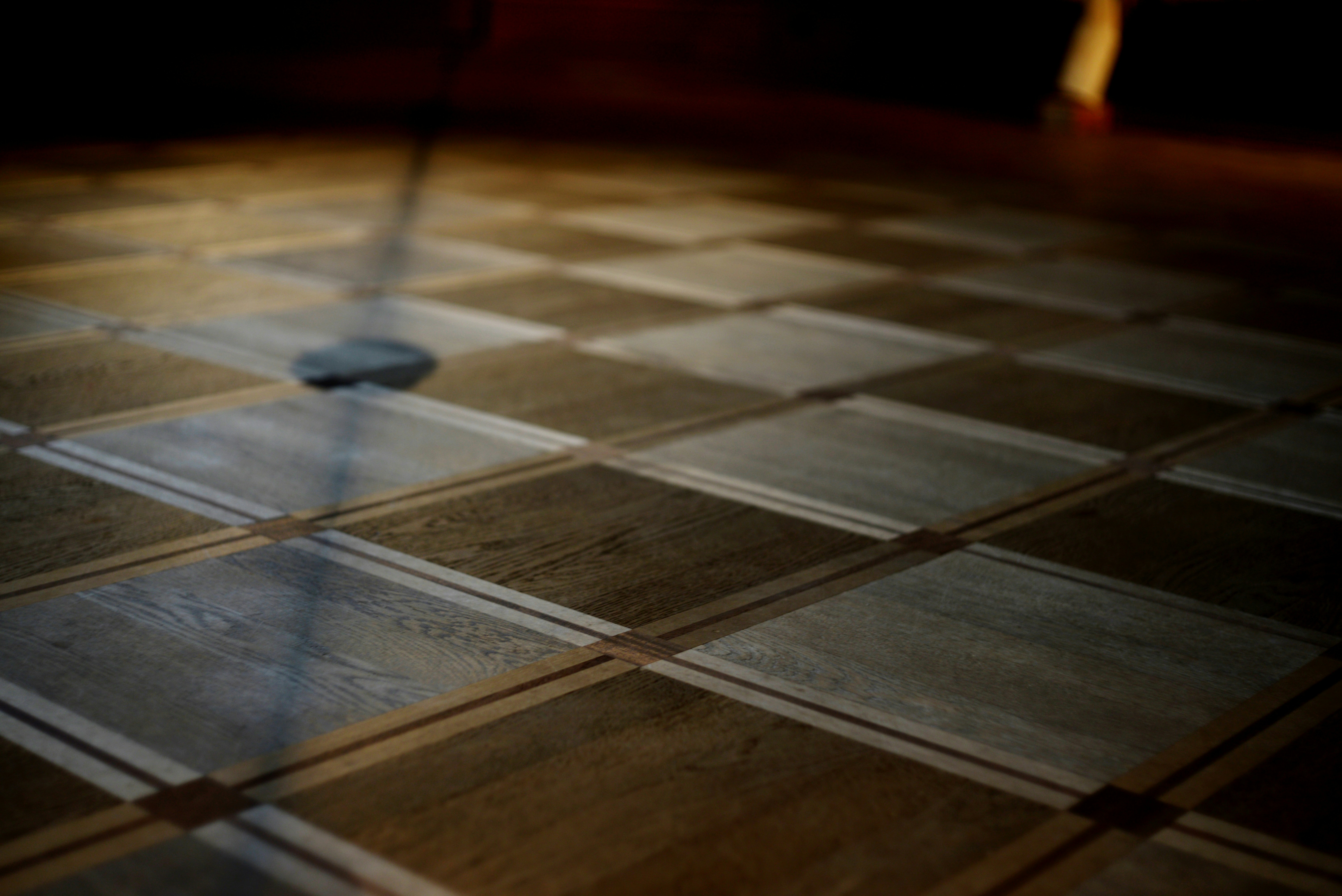 Checkered wooden floor in dim light - Free Photo on Unsplash