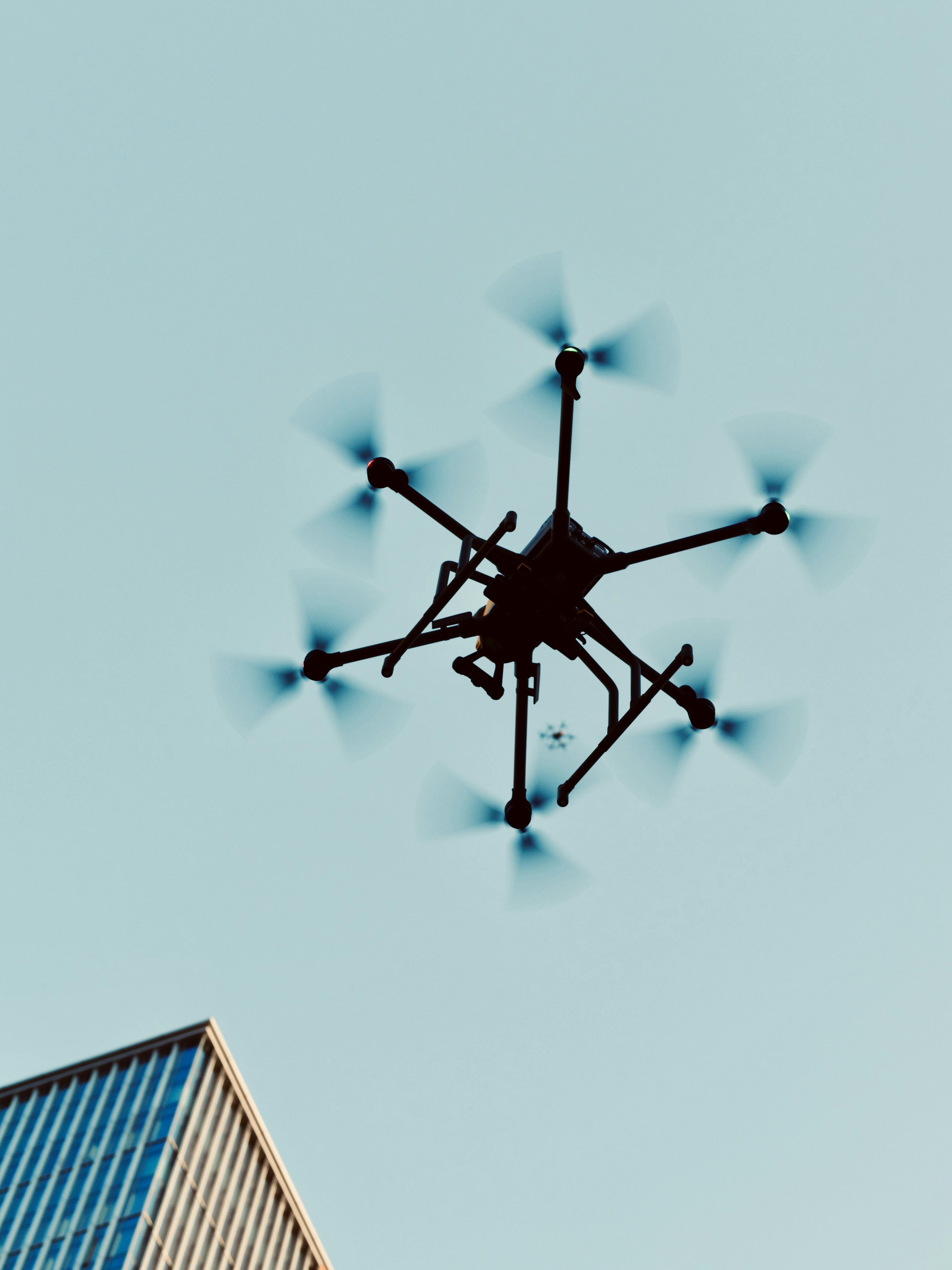 Hexacopter drone above modern building - Free Photo on Unsplash