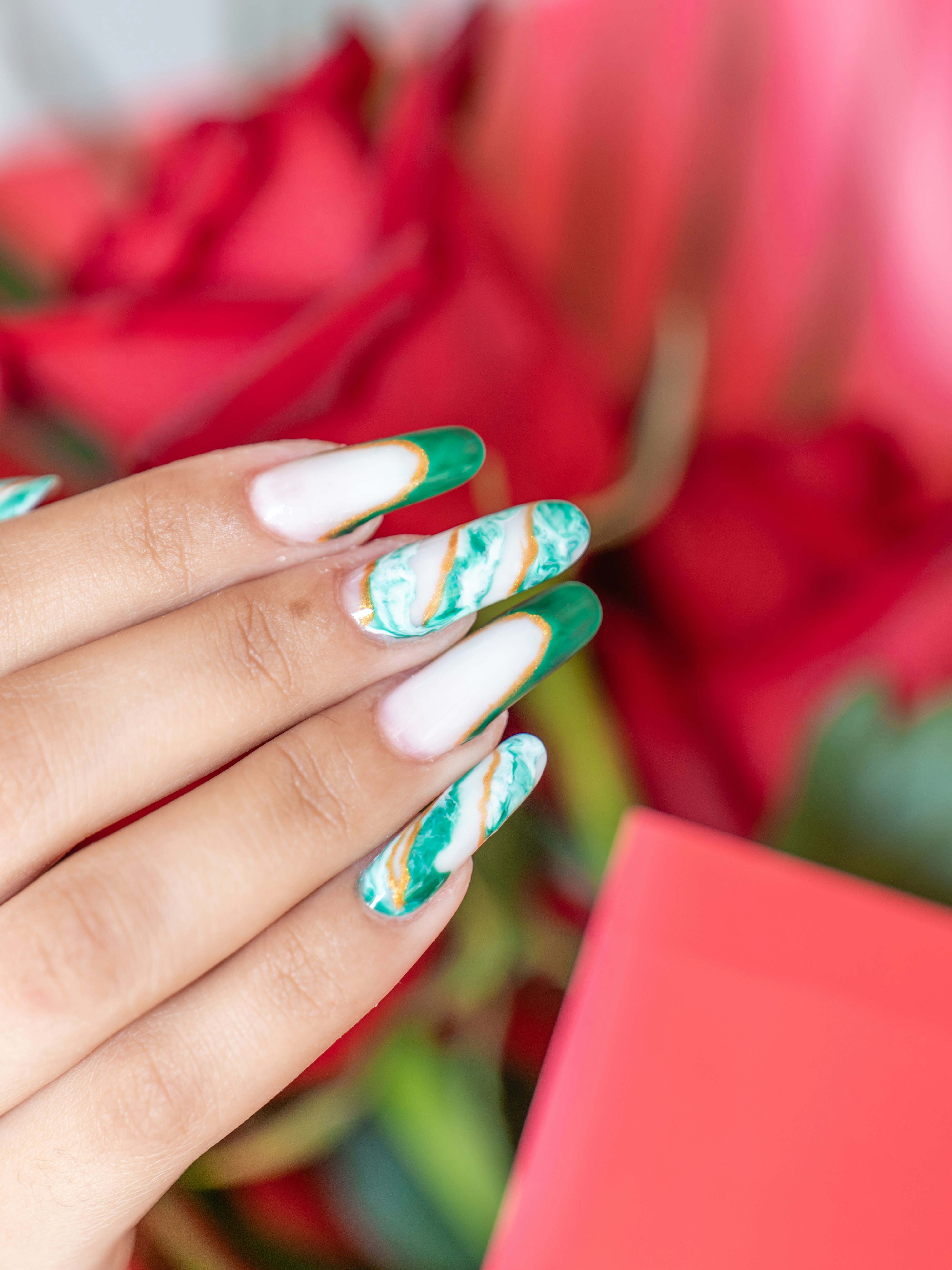 Hand with green marble nail art - Free Photo on Unsplash