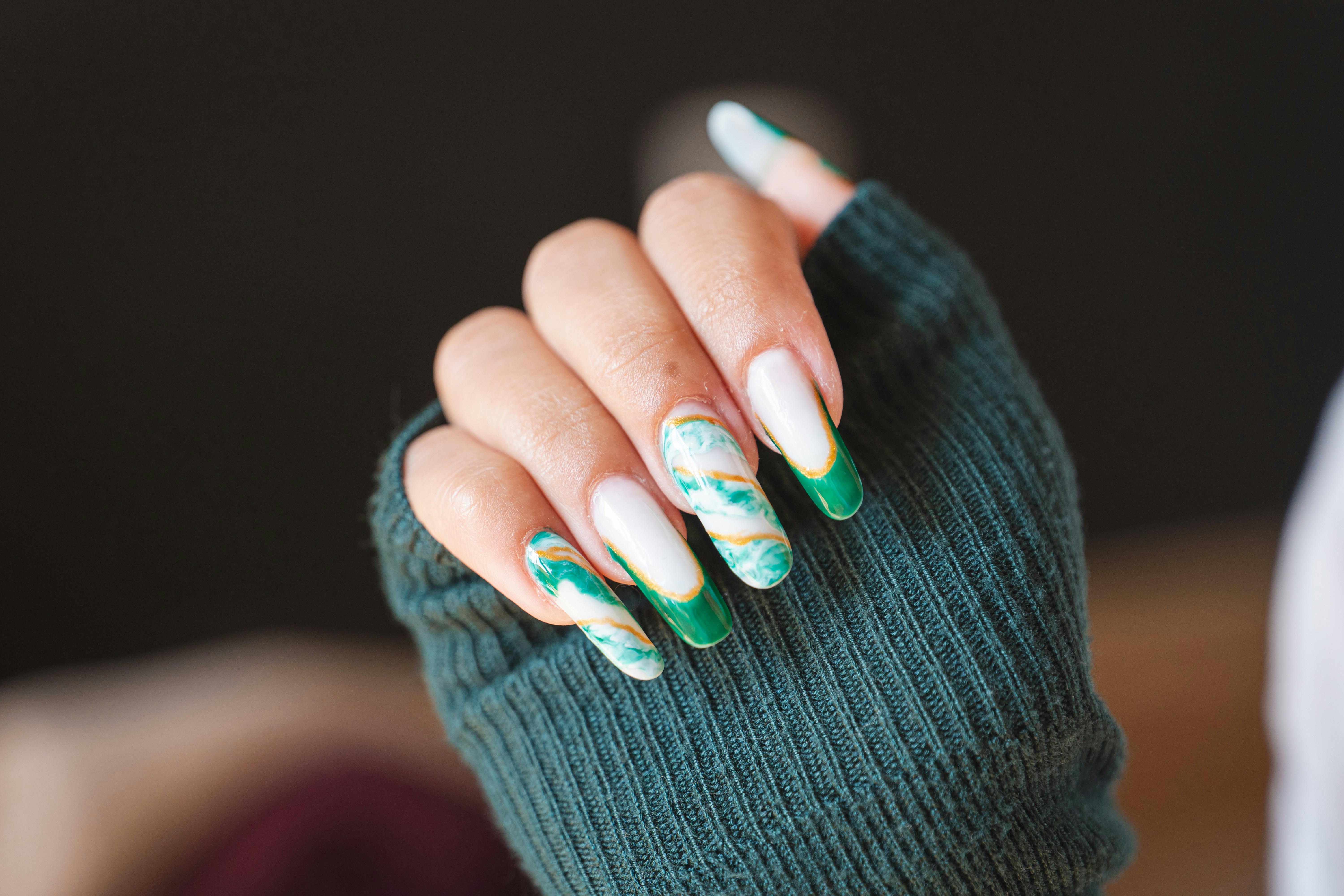 Hand with green marble nail art - Free Photo on Unsplash