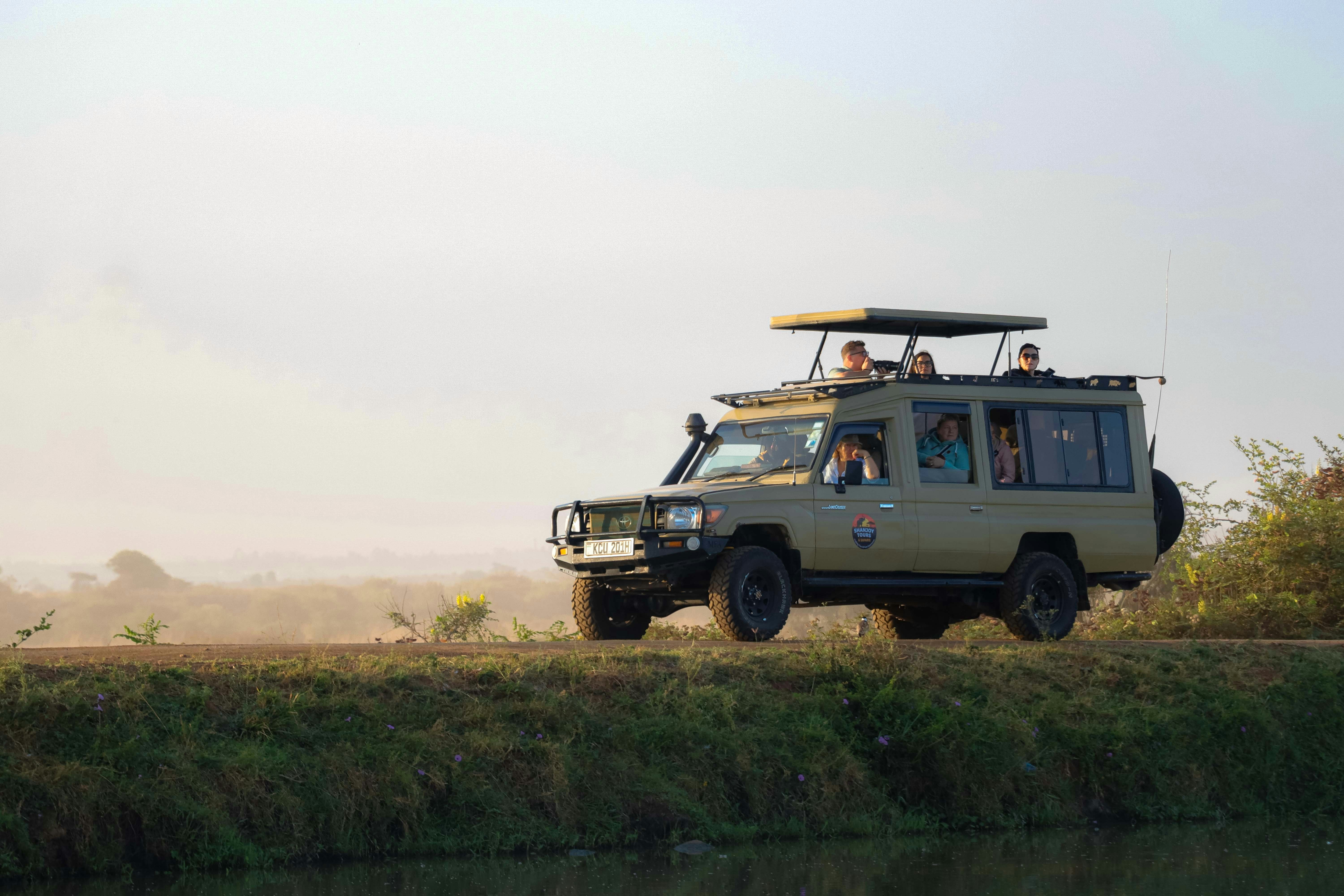Safari vehicle on dirt path - Free Photo on Unsplash