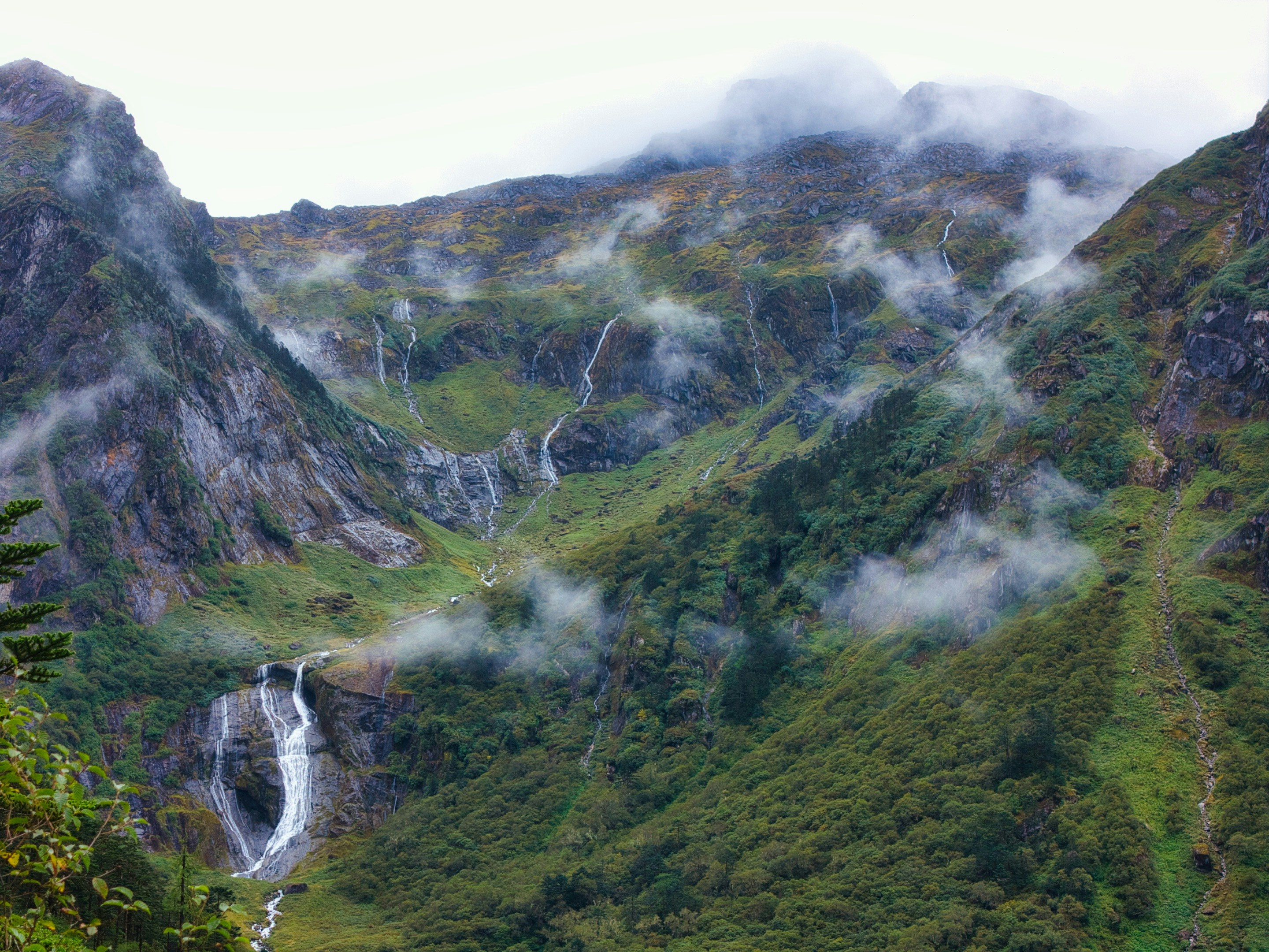 Waterfalls on steep green mountain slope - Free Photo on Unsplash