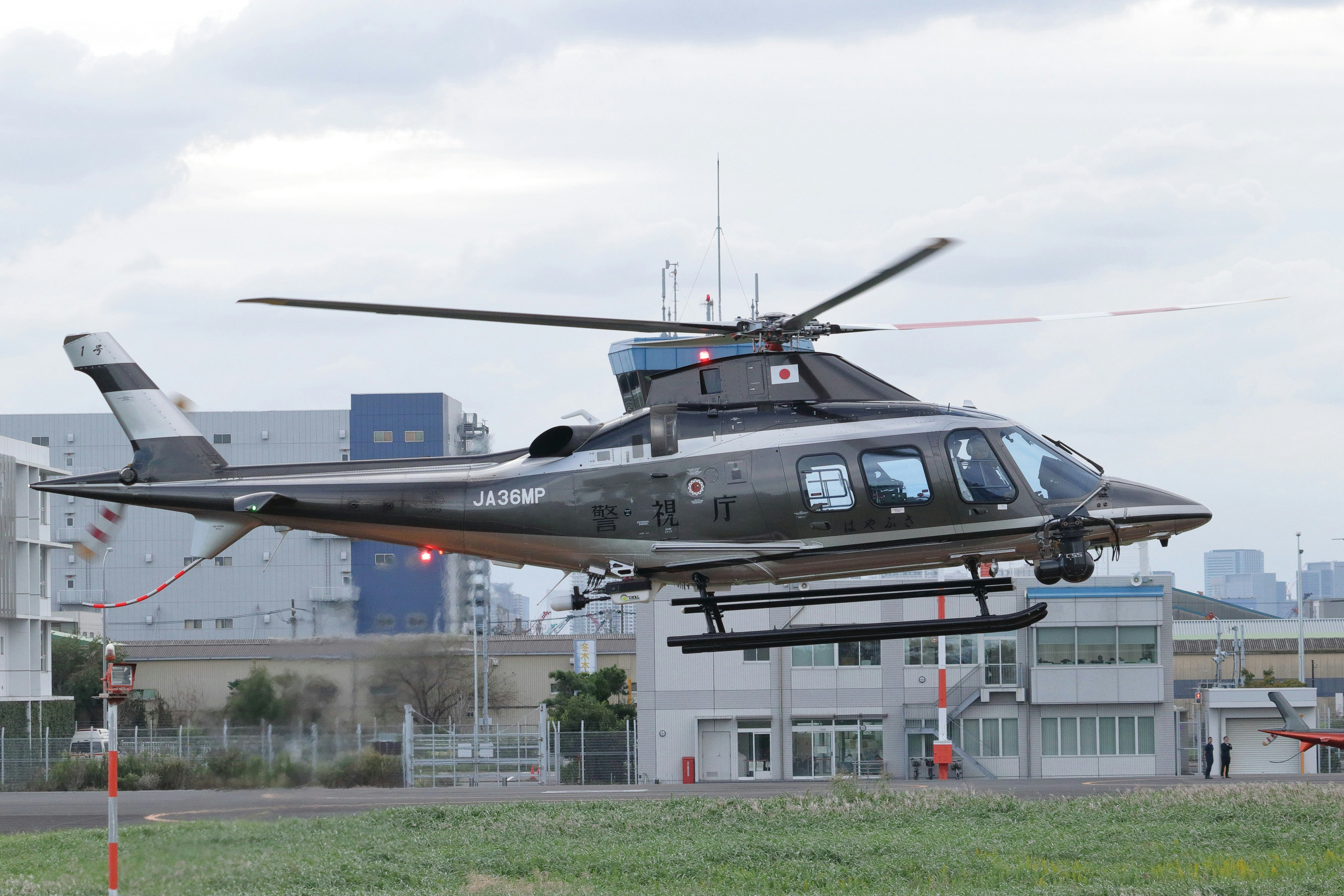 Police helicopter hovering over airfield - Free Photo on Unsplash