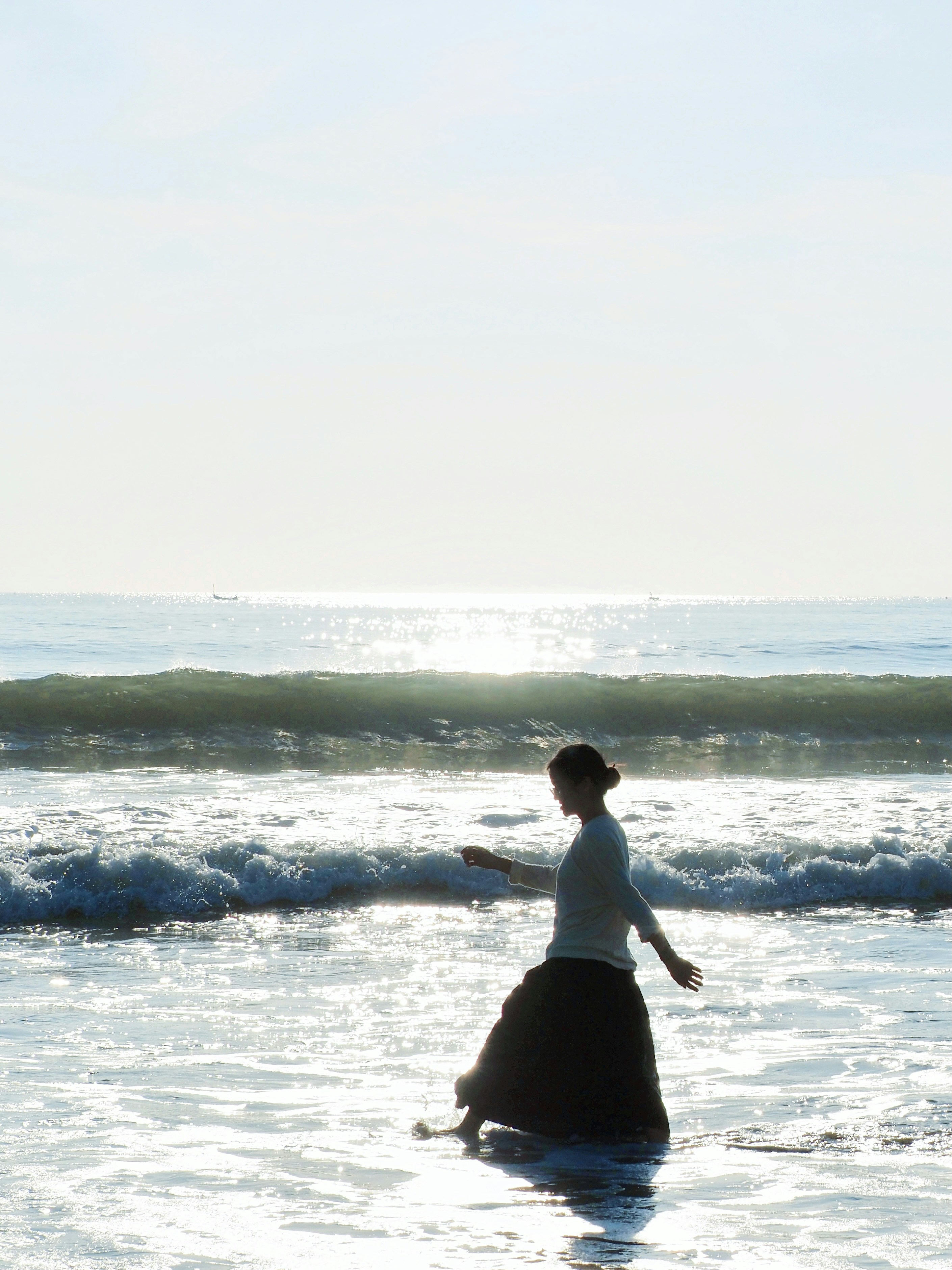Person in silhouette walking in ocean - Free Photo on Unsplash